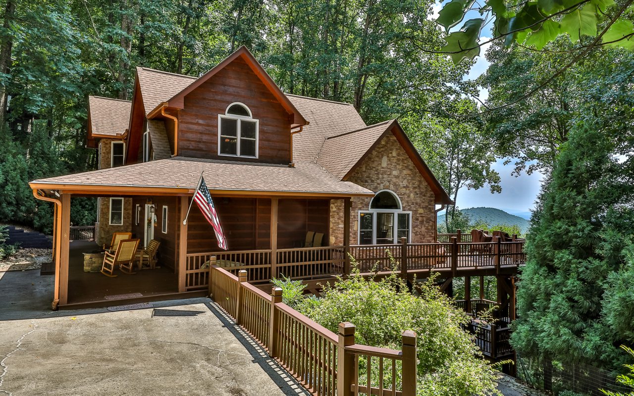 This lovely 4 bdrm/3.5 bath cabin is perched on a ridge to enjoy cool mtn breezes & yr round grand views. As you enter you're greeted with an open floor plan that has a lodge like feel w/a beautiful kitchen w/ample storage & welcoming living room w/a stacked stone gas frplce. You are beckoned to sit & relax in the sun rm that offers peaceful mtn views to enjoy coffee or cocktails. The primary bdrm & en-suite bathrm are located on the main level. The loft has a pool table & you have 2 more bdrms, full bath & sitting area. The terr level bdrm has an en-suite bathrm & private screened porch w/a bubbly hot tub. A 2nd private screened porch offers a nice place to gather/unwind. Enjoy the soothing waterfall from the front porch. Well built home w/2 car garage, whole house generator, 2 gas frplcs & plenty of parking for all. Close to shopping, wineries & dining. Near hiking, fishing and kayaking!