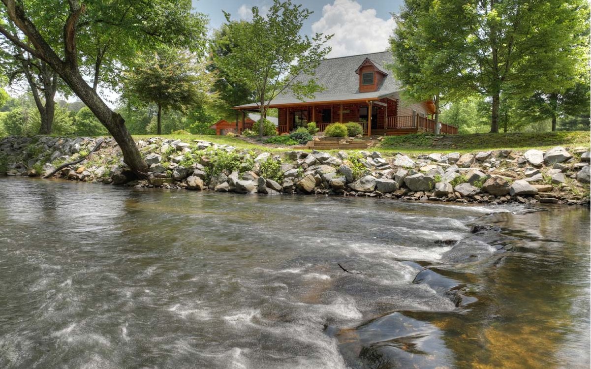 TROUT FISH RIGHT OUTSIDE YOUR BACK DOOR ON YOUR OWN 500 FT SECTION OF STUNNING FIGHTINGTOWN CREEK!! Located in the gated community of Goleega, this home sits on 4.82 level acres with plenty of room for gardening and enjoying the sights and sounds of nature and the rushing creek. This cabin is solid log construction with wrap-around decks and offers an abundance of outdoor living spaces. Interior features large living and dining areas, a kitchen with granite countertops, and SS appliances. The master bedroom opens to the waterfront deck area....let the rushing waters of Fightingtown Creek lull you to sleep! Upstairs boasts a sleeping loft plus two full bedrooms & bathroom. The oversized 2-car garage has plenty of room for cars and storage. If you have been looking for your own creekfront paradise with excellent privacy and close to town, this is a must-see!