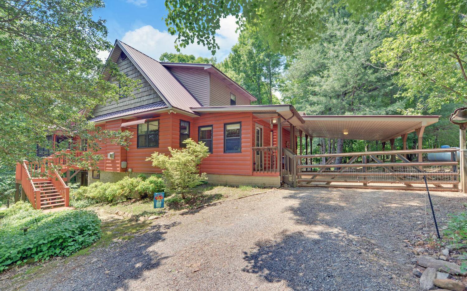 If you're looking for a family home in the country then look no further! This solid log home has a finished interior, master on the main level, country kitchen, a huge walk-in pantry, A 12 ft screened porch, heated floors in the master en suite, full mother-in-law suite with a separate entrance, walk-in closets and much more! Outside you'll find an RV shed with power, barn with workshop area and storage loft, and a fenced garden area with established berry bushes. Located in the country and private but not too far out of town. The finished terrace level could be a long or short term rental to generate income. No restrictions! Home has ETC fiber optic internet for you work at homers and gamers!