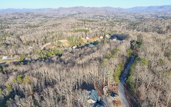 3 Acre Track of Land with Phenomenal Mountain Views! Conveniently Located to Blairsville for All Your Appointments & Shopping Needs. This Acerage is in a Small Community with Minimal Restrictions. Call Me Today so You Can Get Your New Home Plans Started! Carport stays with the property all other items will be removed.