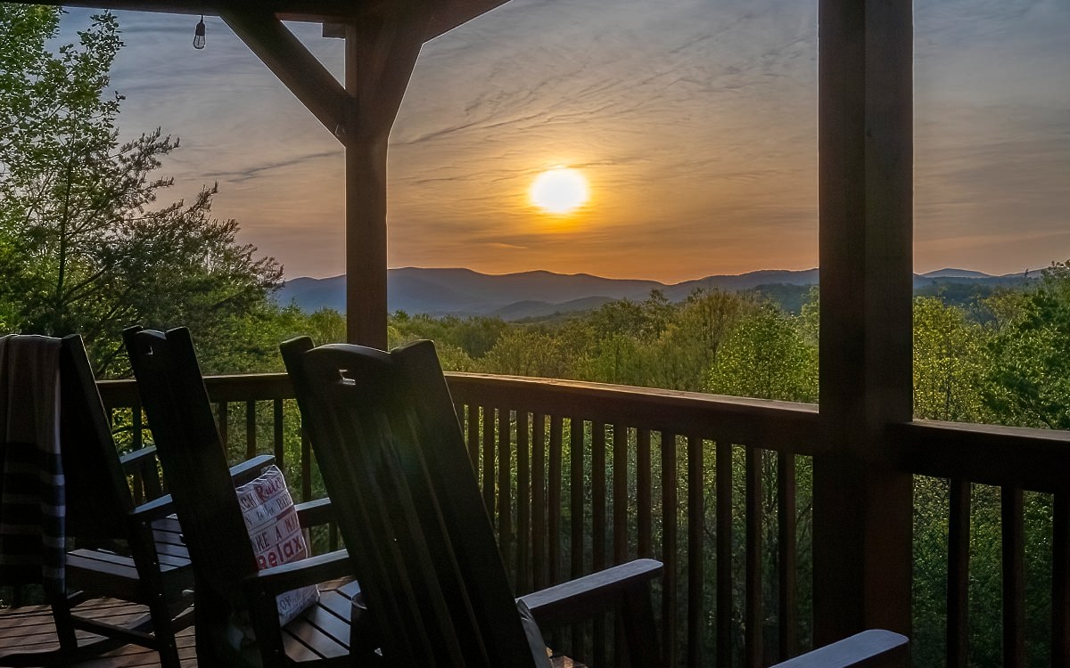 Watch a new day dawn as the sun rises over your very own “Blue Sky Overlook” w/layers of Majestic Mountain views of the Blue Ridge Mtns. From the wide-open Fireplace Porch w/stacked Stone Fireplace to the lofty great room with river rock Fireplace; expect mountain rustic charm in every room & on every porch. The log-sided cabin is turn-key & offers a view from every room; 3 master suites plus a spacious loft area; a large kitchen w/breakfast bar, granite countertops & stainless-steel appliances; the terrace level offers a family room with entertainment for everyone from the pool table, foosball, large screen TV & cozy reading nook to the hot tub porch; more exterior fun on the main porch at the watering hole wet bar or the back yard fire pit area. This is the place you want to be for good times, lazy days & lots of memory-making! The Cabin is in a successful rental program & has lots of parking spaces. It is in the Aska Adventure Area close to the Toccoa River, Lake Blue Ridge & Chattahoochee USFS.