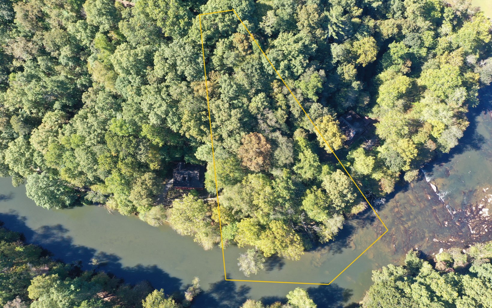 Rare Find! Priced $1,000 below appraisal value. Floor plans & septic already designed as seen in photos($3500 value) and ready to build! Please watch the video:Lush large level yard on the river, near rapids on the Coosawattee river on a private cul-de-sac road. Build your full-time home or investment property right in this vacation resort in the mountains. Site plans have already been made for an elevated piling home by the river. Subdivision allows for vacation rentals and has tennis courts, fishing pond, 5 Parks, 2 outdoor and 1 heated indoor pool, pickleball, 18-hole miniature golf, camping lots & RV lots by the river and pool, Basketball courts, etc. Close to wineries, apple orchards, hiking, kayaking tubing, etc. Wake up to deer roaming free in this protected wildlife subdivision. The mountain life awaits! Welcome to North Georgia, what are you waiting for?