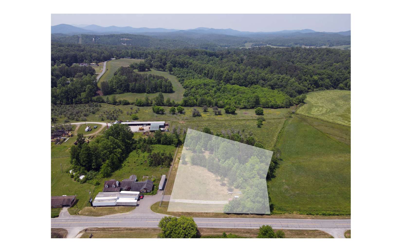 Level, Commercial lot with frontage on Murphy Highway not far from Hwy 325/Nottely Dam Road. Fenced and gated. Convenient to Murphy, Blairsville and Lake Nottely. Mostly cleared. Beautiful property with branch bordering the right side of the lot (from road). Perc Test on File. Storage container and other equipment negotiable. Utilities being verified.