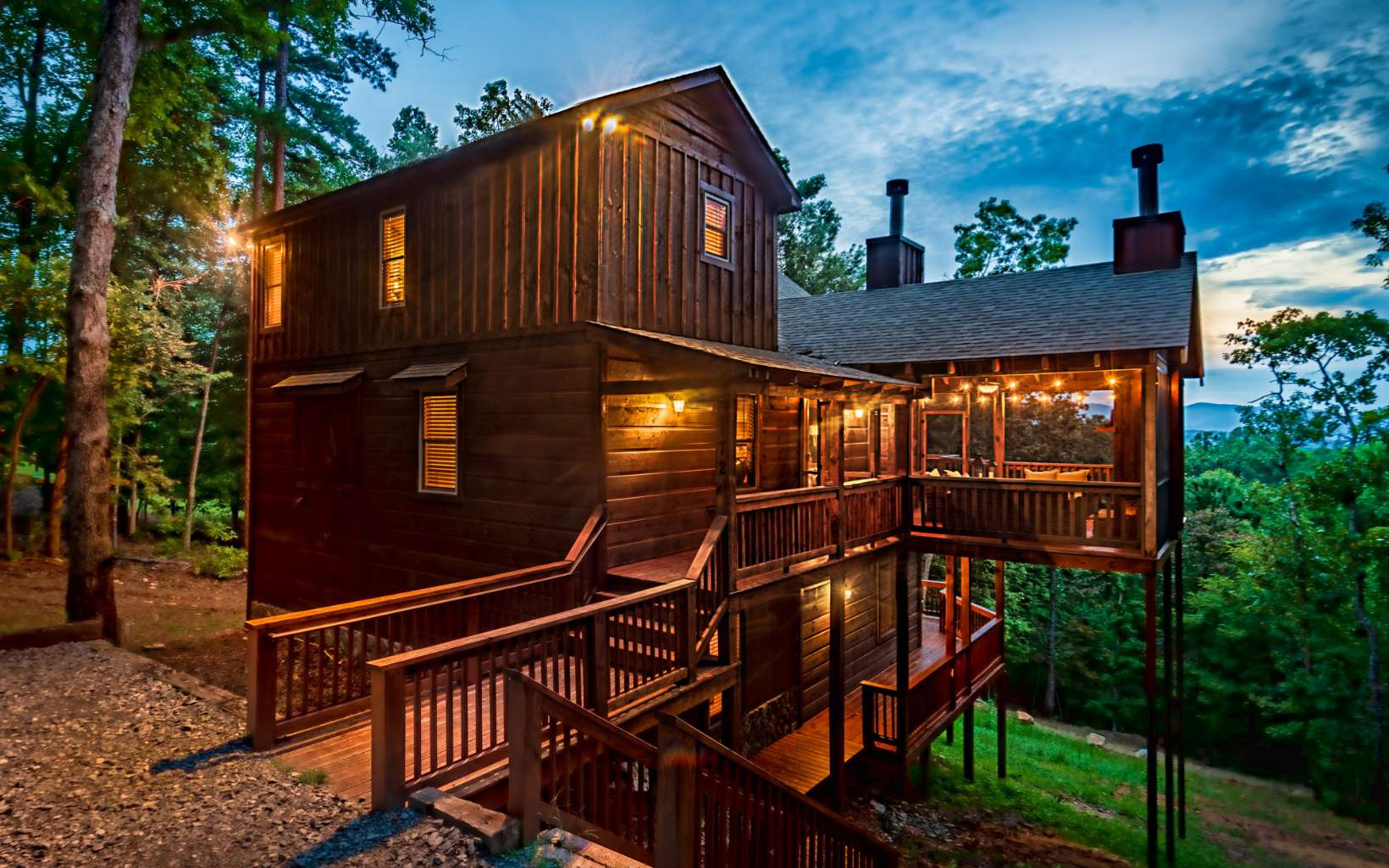 Unobstructed layered mountain views for miles!! Surrounded by National Forest, but just minutes from DT Blue Ridge, you get the best of both worlds! This rustic mountain getaway features a glass wall in the great room, bringing the outdoors inside. The unique Blue Pine interior paired with warm lighting creates a cozy & inviting atmosphere where you'll feel right at home. The main level offers a large kitchen with granite countertops and an open concept dining & living room complete w/ a wood burning fireplace. The living area extends to an expansive deck overlooking the breathtaking views. With a basement bunk room, game room w/ wet bar & hot tub on the terrace deck, this cabin is sure to comfortably host many guests! Located in the highly desired Hemptown Heights neighborhood w/ all paved access, this cabin would make an incredible full time home or investment property! Come take a look!!