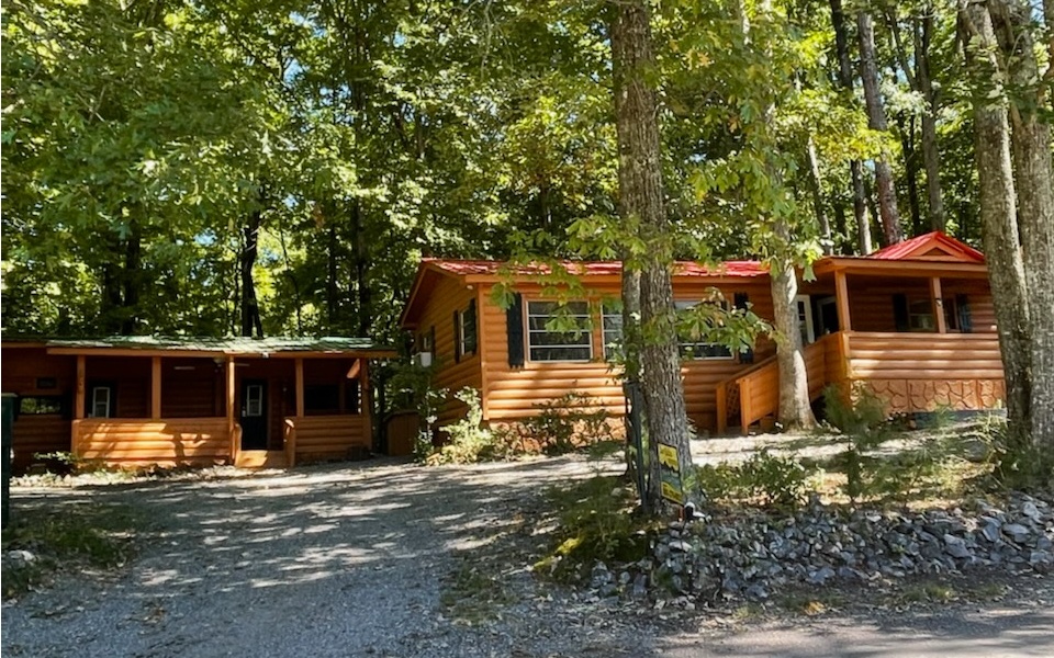 NEED A LITTLE GET-AWAY Cabin? AND Guest Cottage? Then look at this. Log sided completely enclosed with a additional Hugh living area w/fireplace, beautiful laminate floors, Metal Roof, Workshop/storage,extra sleeping quarters off back room PLUS a separate guest quarter's RV that has log-siding also and covered porch! Beautiful Million Dollar VIEWS of Brasstown Bald from your covered front porch....All for an amazing low price