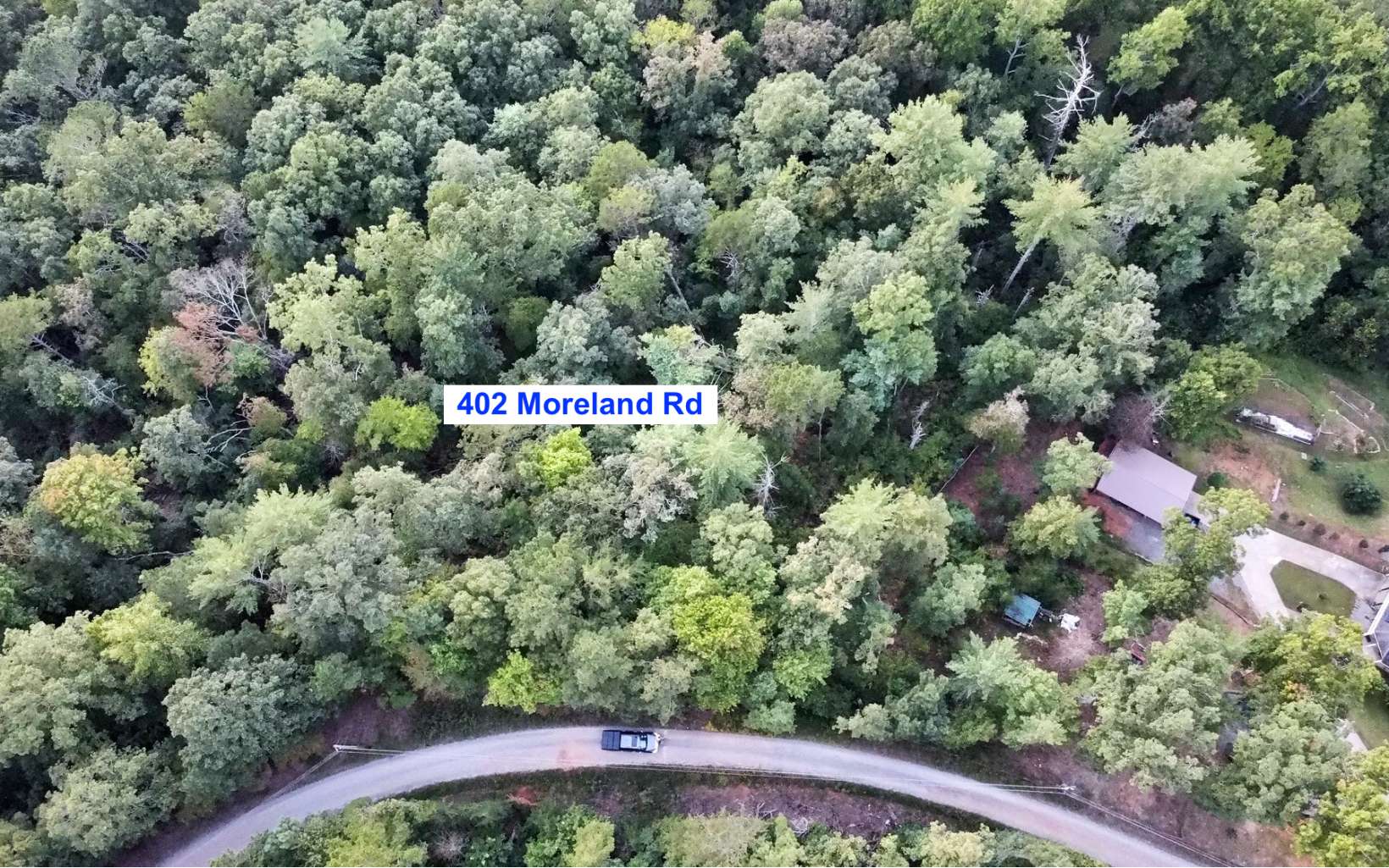 Build your primary or vacation home on this 3.84 acre lot with seasonal mountain views! This lot is located on a quiet gravel road yet within minutes of Hwy 515 and all that Ellijay has to offer including the Mountaintown Creek nearby! Septic system and non functioning drilled well already on property. Non restricted subdivision. Live the North GA mountain life!
