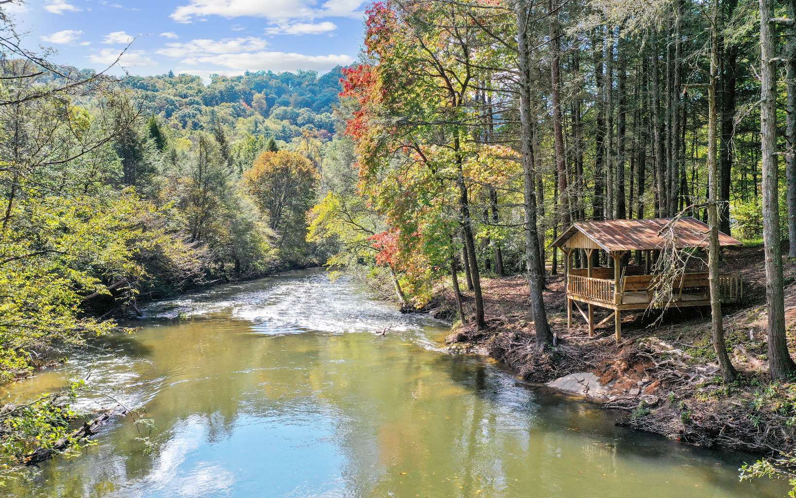 TOCCOA RIVER FRONTAGE!! 357.88+/- FEET ON RIVER & BLUE RIDGE CHATTAHOOCHEE NATIONAL FOREST ACROSS RIVER and one side of property line!!! 25+ acres W/Pavilion on Rivers edge. TRULY ONE OF A KIND DREAM PROPERTY!! GEM!.. Main Cabin 3/2, Spring house/Cottage 2/1 sitting at spring; apartment 1/1 above carport. Garages' & NEWLY installed generator for all homes. Pasture, Barns, sheds. Well at garage and barn! All homes, garages and Barns immaculate! Easy access to Barn w/stalls and equestrian interior! FAMILY RETREAT! INVESTMENT PROPERTY! HUNTING/TROUT FISHING PROPERTY! OR FAMILY FARM & BRING THE HORSES!!!(ONLY 15 to 20 MINUTES FROM BLUE RIDGE, SUCHES, BLAIRSVILLE AND ELLIJAY)(Blue Ridge/Dial area property but has a Suches 911 address)