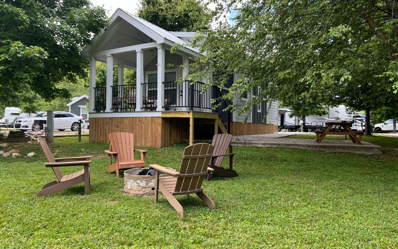 TURN-KEY Tiny Home on HEMPTOWN CREEK. Room to sleep and entertain up to 8, ample parking, beautiful creekside sitting area with firepit. Everything is included and ready to go making it great for vacation rental! Minutes from downtown Blue Ridge this gated RV and Tiny Home Community offers it all! Amenities include river access, two ponds, community water and septic, dog park, frisbee golf course, multiple fire pits, community pool and hot tub, playground, pondfront clubhouse, laundry facility, community kitchen with wood-fired pizza oven and fireplace, washrooms, and fishing dock with stocked community pond. Call the mountains your private getaway and produce income by renting your cabin while you are adventuring elsewhere!