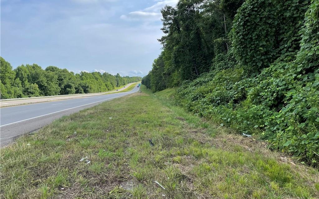 26.27 Acres Zoned C-1 Commercial just 2 miles South of Ellijay with 739 feet of Highway 515 frontage. Endless opportunities with additional frontage on Old Highway 5. With Gilmer County permitting, come build an RV CAMPGROUND, BOAT & RV PARKING, OFFICE WAREHOUSE & BUSINESS PARK, ASSISTED LIVING COMPLEX, MINI STORAGE WAREHOUSES, MANUFACTURING FACILITY, RETAIL SERVICES, and many other opportunities with any kind of Commercial application.