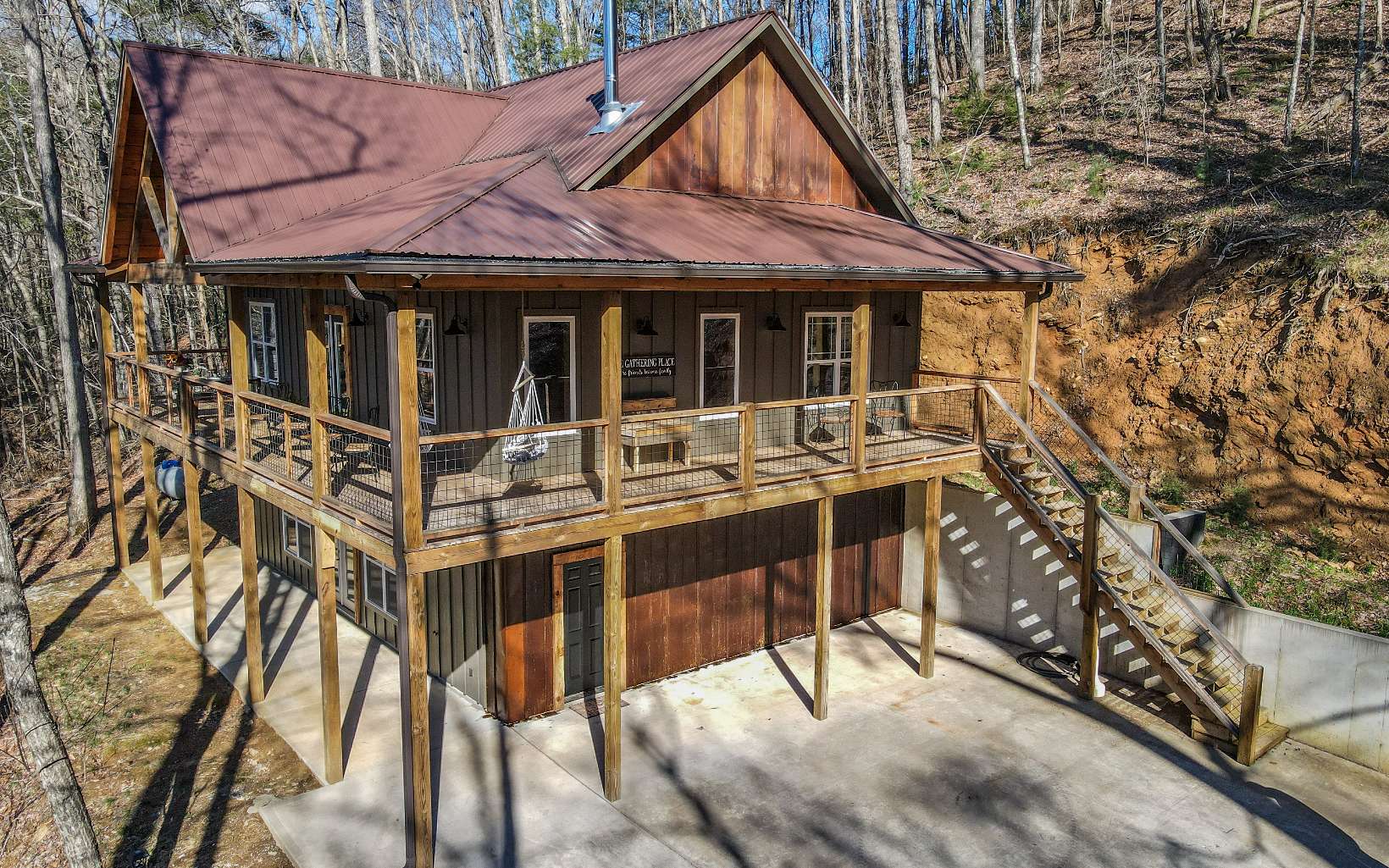 Is it a beautiful mountain home in the woods in Cherry Log that you're looking for? Or is it an excellent short-term rental that sleeps 10 people? This is the DREAMHOME that you've been searching for! With plenty of seclusion and soothing sounds of the creek and surrounding nature, this handcrafted, custom home sits on 1.48 acres of land. This mostly furnished, NEW CONSTRUCTION home has been beautifully decorated and was designed to be energy efficient with zoned heating and air. The primary bedroom and bath are on the main level along with a second bedroom and bath. A large open kitchen, dining and living room combo for a grand area with with high tongue and groove ceilings and a beautiful hand crafted mantel with a wood burning stove. The lower level has a bunk room area, bathroom, laundry and large game room which is perfect for a pool table and bar. This won't last!