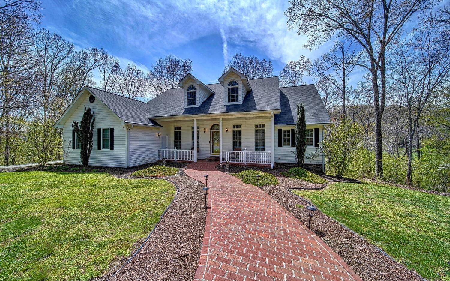 This stately home provides you all the privacy you could hope for but is conveniently located w/in 5 mi of Downtown Blue Ridge, Ingles Grocery, hospitals & schools! Year Round creek, mountain & pastoral views! You'll be in awe as soon as you walk in. The main floor consists of a formal dining space, butler's pantry, eat-in kitchen w corian countertops & custom cabinetry, living room w cathedral ceilings, spacious MBR en suite, office, laundry room, 1/2 bath & a 2 car garage. The upper level has 3 br's & a full bath + a craft room. Full, partially finished terrace level offers bonus family/rec room, gym, full bath, & loads of storage space! This 9.06 acres boasts over 1000' of noisy creek frontage (Sugar Creek), a small fishing pond, a 20x40 detached garage w storage space above, a detached carport (perfect for rv or boat), a lean-to shed & a 24x30 storage building!