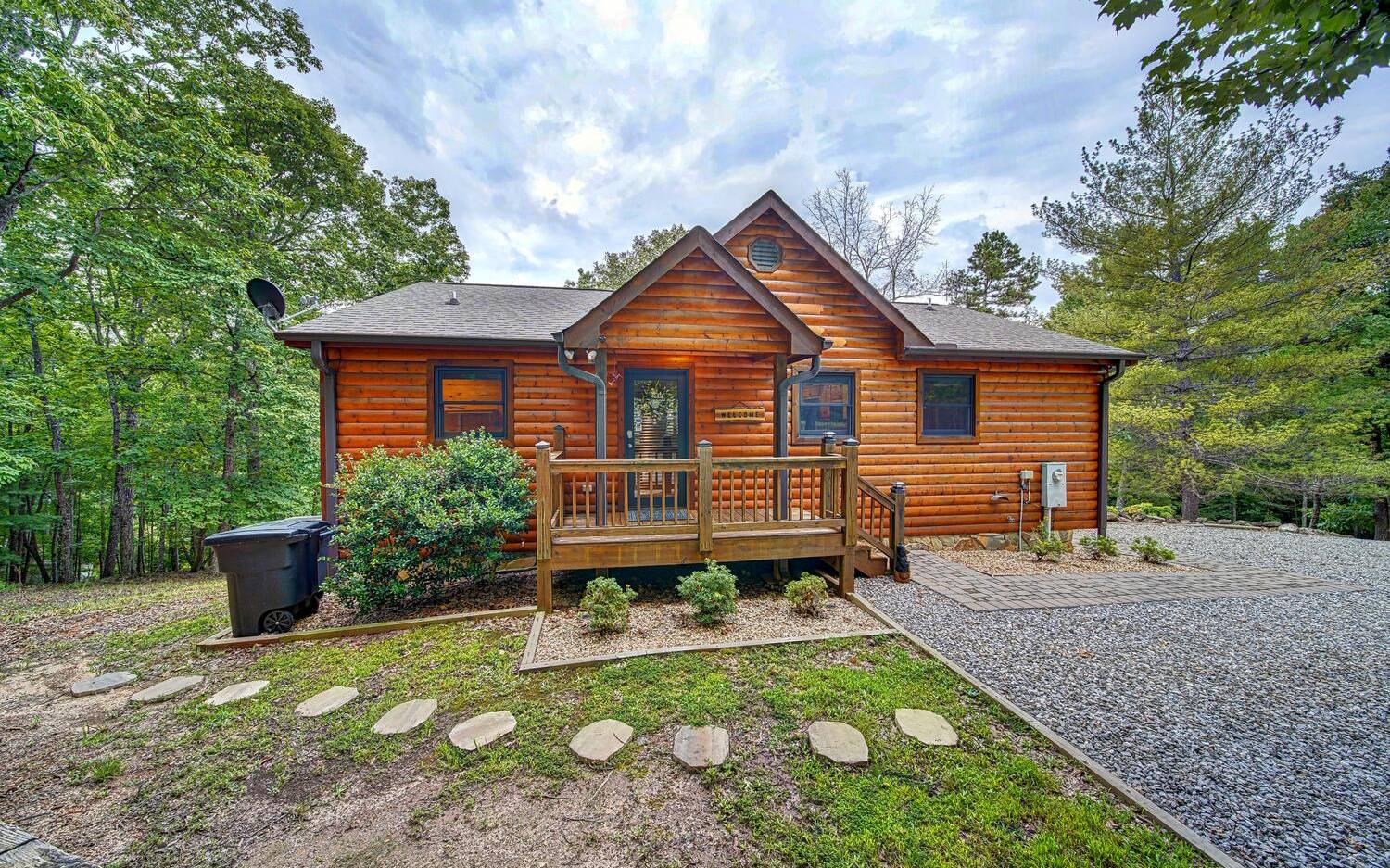 This 3BD/3.5BA cabin is a Turn-Key successful Vacation Cabin Rental/Part time Owner Residence. Split master bedrooms and Laundry on main level!! Make this your full time or vacation cabin. Easy access on paved roads and located conveniently between Blue Ridge and Blairsville. Finished Basement with Family Room, Bedroom/Full Bath and Workshop/Storage area. The cabin has whole house water filter system, large designer hot tub and security cameras. Property has level parking for several cars. All this PLUS a Seasonal Mountain View! Brand New HVAC, Kitchen Stove & Hot Tub.