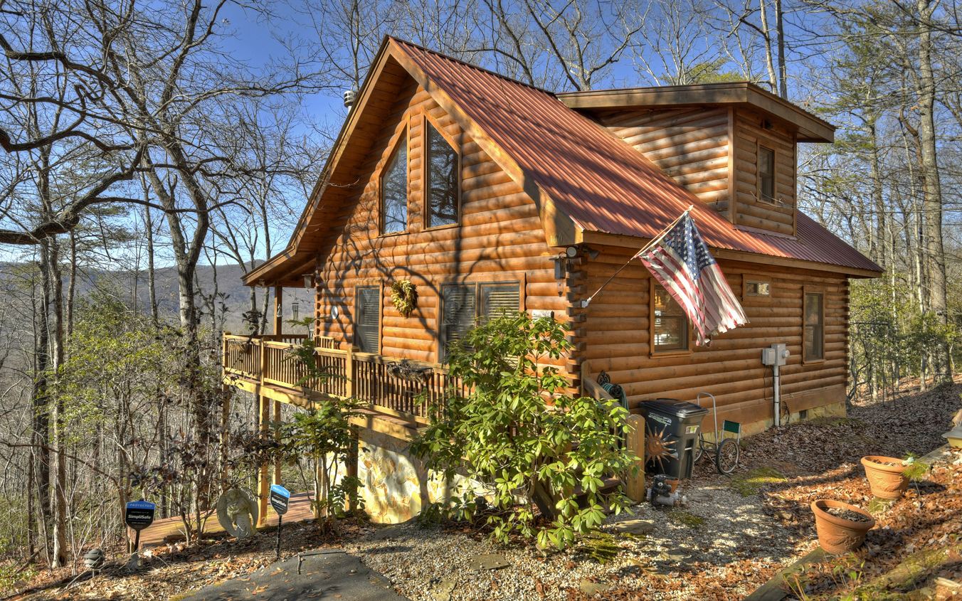 Cabin life is the best life… Tucked away between the lovely mountain towns of Blue Ridge & Ellijay with picturesque mountain scenery all around, this cozy cabin is perfect regardless of your intentions. Full time living? The great escape? Either way you’ll enjoy the peace and quiet as you’re surrounded by beautiful hardwoods, plentiful natural amenities, and entertainment galore - dining, shopping, Lake Blue Ridge - the list goes on. You’re also in close proximity to all your daily needs with easy access to Hwy 515. This wood retreat offers two bedrooms and one bathroom on the main, laundry, decking to enjoy the fabulous mountain view, and open living room and kitchen with stacked stone fireplace and soaring ceilings that lead you to the upstairs loft bedroom and bathroom. Other highlights include: stainless appliances, granite countertops, hardwoods throughout, and furnishings also available. Let’s the memory making begin!