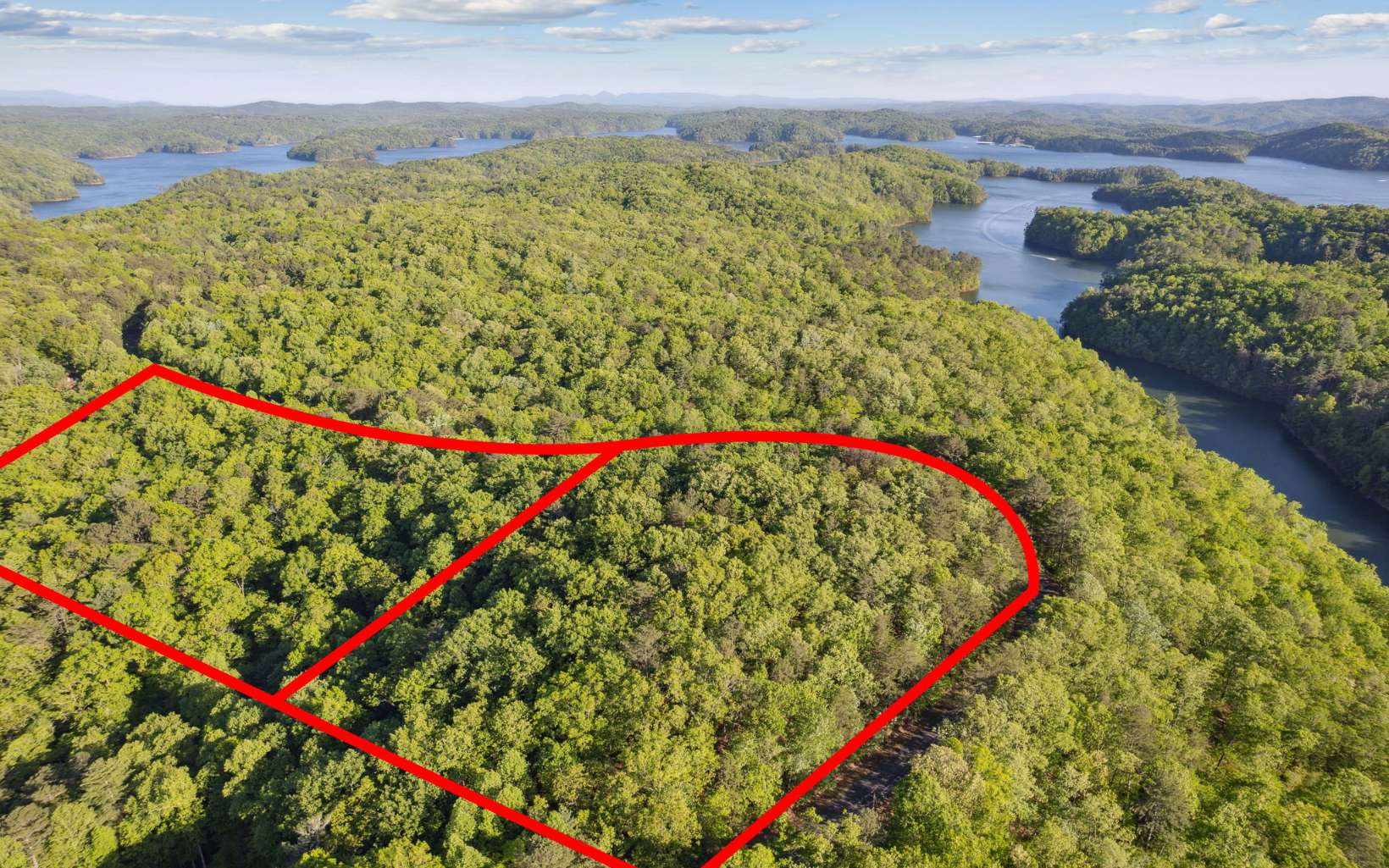 This is an amazing opportunity to own two adjoining wooded lots in North Georgia. These lots offer multiple buildable sites and great access to outdoor recreation. (potential lake/mtn views) They are just a short drive away from the Woodring Branch boat ramp for Carter's Lake, making them perfect for anyone looking to enjoy a day of fishing, kayaking, or canoeing. The lots are also great for biking and trail hiking, featuring beautiful wooded landscapes and rolling topography. Woodring Branch Campground offers primitive and developed camping right at your back door. (less 1 mile) There's several covered picnic tables scattered out on a private like peninsula into Carters Lake for your enjoyment. Choose to explore and hike around the lake down one of 2 trails, Oak Ridge Nature Trail and Amadahy Trail. Don't miss out on this incredible opportunity to build your dream mountain getaway!