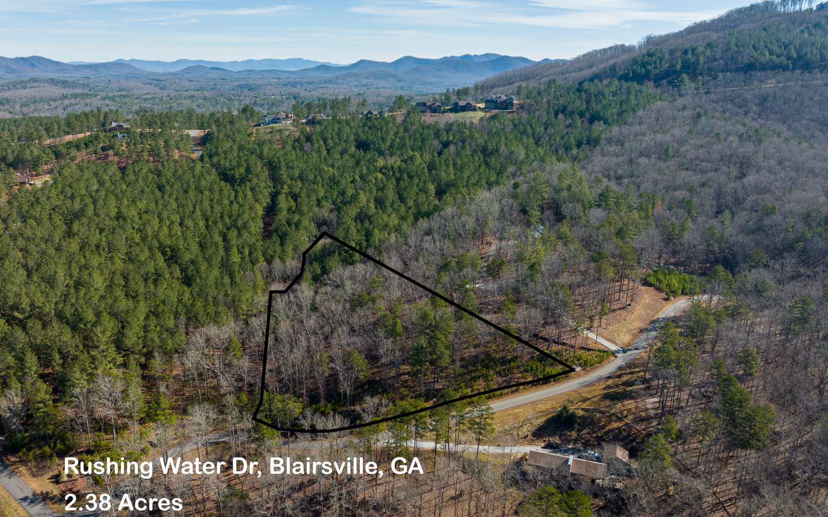 Beautiful 2.38 acres lot in a quiet prestigious gated community in Blairsville offers access to Lake Nottely, community lodge. Lot has a flat area in the center where it would be perfect to build your dream mountain home. Partial views of Lake Nottely, there is a stream running from the back of the lot to the left side. Community is very active and there always activities for residents. Bring your kayaks to access the lake from the subdivision.