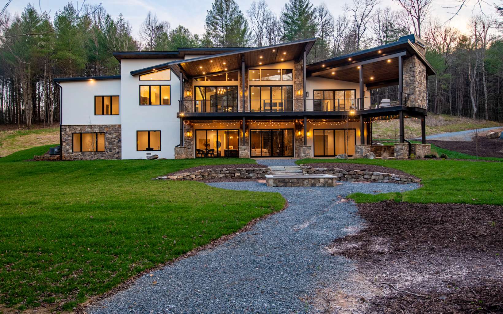 This new construction home is a stunning example of mountain modern architecture, boasting 4 spacious bedrooms, 3 full & 2 half bathrooms. Situated on 3 acres w/ 439 feet of Fightingtown Creek frontage (add'l 14.35 acres & creek frontage available). One standout feature of this property is the extensive use of steel I-beams throughout the home, which adds a modern and industrial aesthetic to the design. The use of maintenance-free materials throughout the property means that the home requires minimal upkeep. The home is filled with natural light and has high-end appliances & fixtures, quartz countertops, imported Italian porcelain tile & wide plank-engineered hardwood floors on both the upper and lower levels. Built by highly-regarded builder Tommy Wosyluk, the combination of his expertise and the home's outstanding design and finishes make this property a truly unique & one-of-a-kind!