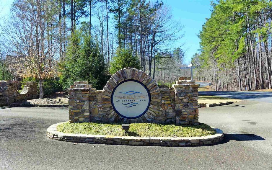 Welcome to Tranquility at Carters Lake - One of Gilmer County's most distinguished and impressive communities! This 2.54 acre home site has a mountain view and is 2 minutes from the Carters Lake / Doll Mountain recreation area with boat ramp, camping, picnic & fishing. This lake is the deepest of Georgia's reservoir lakes known for its solitude and scenic beauty with sparkling waters and rugged shoreline. The neighboring Tranquility community offers landscaped grounds, walking trail along Harris Branch Creek, playground and a craftsman neighborhood pavilion. All paved roads, public water - Located 10 minutes from Ellijay and approx. 70 miles from Atlanta.