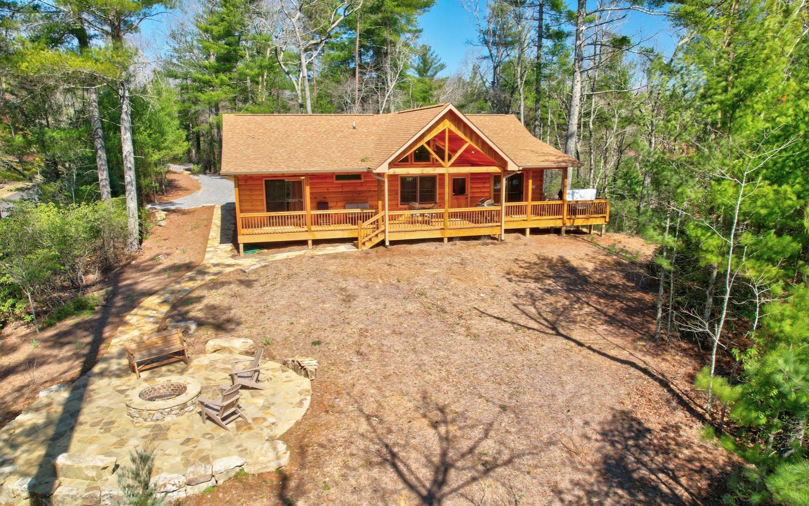 Long range mtn views, ADA compliant, true log, amazing landscaped level yard with outdoor firepit, covered parking, granite countertops, less than 2 miles to downtown Blue Ridge?? This 3 bedroom/2 bath open concept log cabin in beautiful North GA mountains is a 2 yr old all one level hitting all of those plus is a successful STR being sold turn key with wrap around decks, hot tub, and upgrades galore. Schedule your showing today.