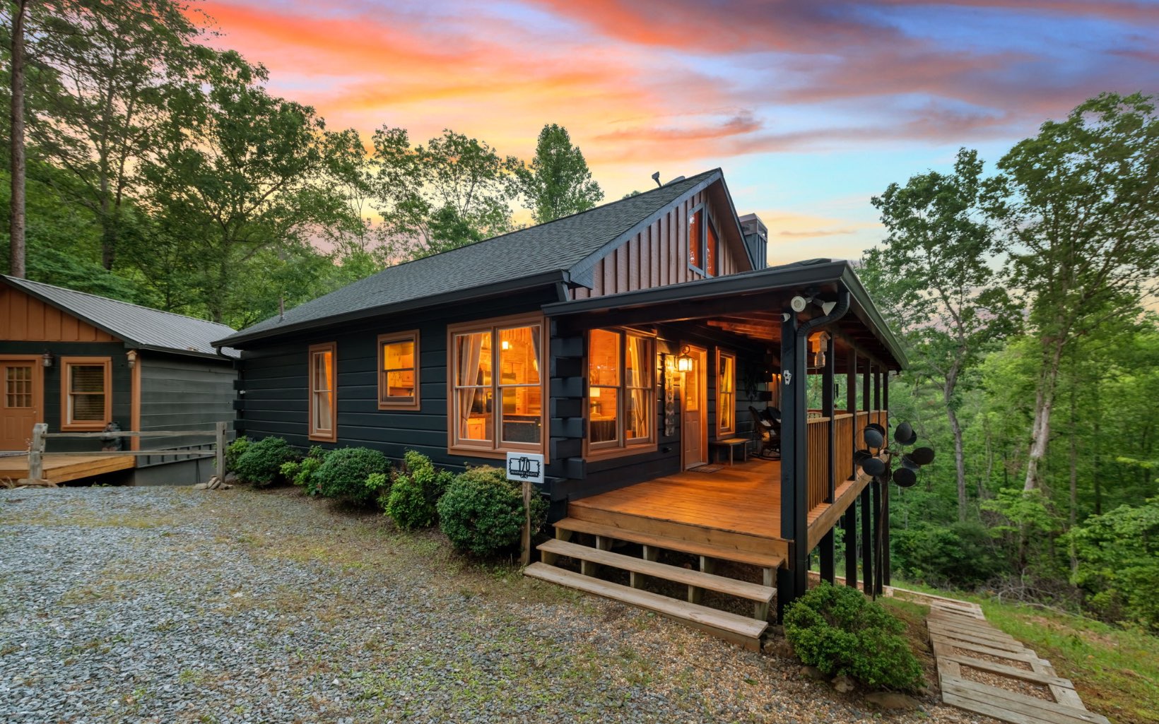 Tucked away in the heart of the Blue Ridge Mountains and exuding charm and rustic flair, welcome to "Knotty by Nature!" Classic log home w/ reimagined contemporary elements is complete with three full bedrooms, two full baths, an additional sleeping loft making for a total of four bedroom area, large living room w/ stone F/P, wraparound deck, and full terrace level den area w/ bar and game room! Outside on the terrace level, find a large covered jacuzzi deck and gorgeous backyard. In addition, cabin has a detached studio w/ electric that could make for a perfect artist studio, guest house, or bunk room -- all you need is the vision! Complete with a one car garage underneath the studio, sold FULLY FURNISHED, and with an additional lot sold WITH THE CABIN that also has community water and utilities -- this cabin won't last long! Call today.