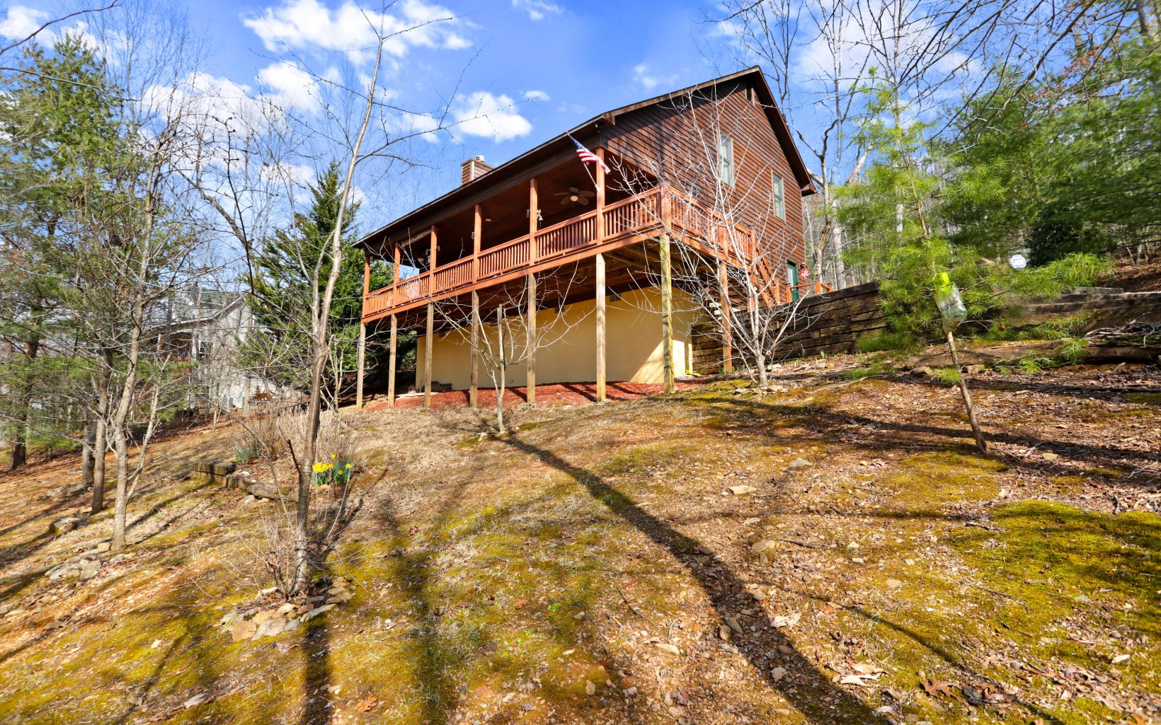 QUALITY BUILT CABIN IN THE NORTH GEORGIA MOUNTAINS!! This home offers an open floor plan, great room with vaulted ceilings & a soaring floor to ceiling stacked stone wood burning fireplace, solid maple cabinets in kitchen and oversized laundry/pantry and baths, beautiful blend of wood & drywall, huge master bedroom, bath with double bowl vanity, separate shower & garden tub & walk-in closet, large covered back deck. Upstairs bedrooms are spacious and have a large Jack & Jill bath with separate vanity & nice upgrades throughout. Unbelievable size bonus room with storage space that would be a great hobby room or office. Lots of storage room in stand-up crawl space. Plus 2 peach trees, 4 apple trees, 2 cherry trees and 2 pear trees.