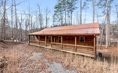 Wide River Frontage w/ large level backyard bordering wide river frontage! Cabin on the River built in 2018 with full unfinished basement. Efficient layout w/ vaulted ceilings and plenty of windows for natural light. The deck and front porch extend the length of the house. 2 master suites on the main level. This is a great cabin in Coosawattee with easy, paved access from the main gate. Come on and see yourself in this newer cabin, with large, deep, and level backyard - built 2018! I drive my Lexus midsize suv down the driveway multiple times and back up just fine. Let me tell you about the driveway. The gravel is packed in and if you come in from the opposite directions (follow my signs) then you can drive right down. It's not that it is steep - it's the angle. Call me! I'll show you how it's done! It's just like any great home, you get used to it when you figure it out. Forthcoming is a picture of how it's done! This place is a gift!! You have a private escape and can enjoy grilling or early morning coffee. Come sit on the deck and take in the ambiance!