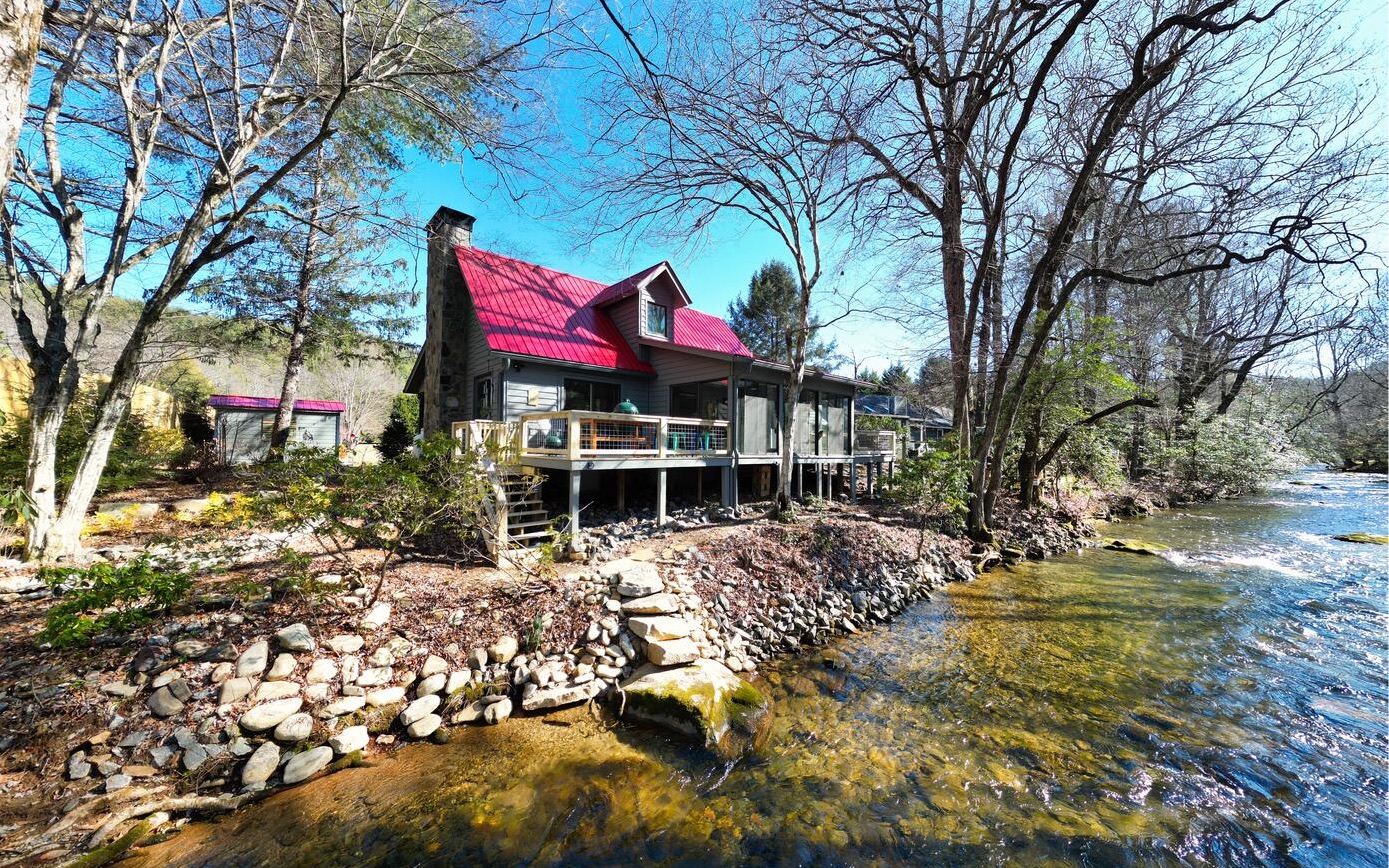 Beautiful Riverfront Gem of a cabin!! This 3BR/2BA cabin is newly remodeled situated on the banks of the Hiawassee River & boasts a modern fresh look: Features include a newer Kitchen & Stainless Appliances, Tile baths, shiplap interior wall, Gas FP, Custom Cabinets & counter tops, Infinity Windows, new decks, new blinds, a dual fuel gas range & elec. Oven, Gutters, incapsulated crawl space & new HVAC system. In addition this cabin comes furnished, Boasts a beautiful riverside sun room, multiple decks/porches & a detached garage. Ready to start enjoying day 1!! Located in Hi River Country with great trout fishing. This is the one you have been waiting for.