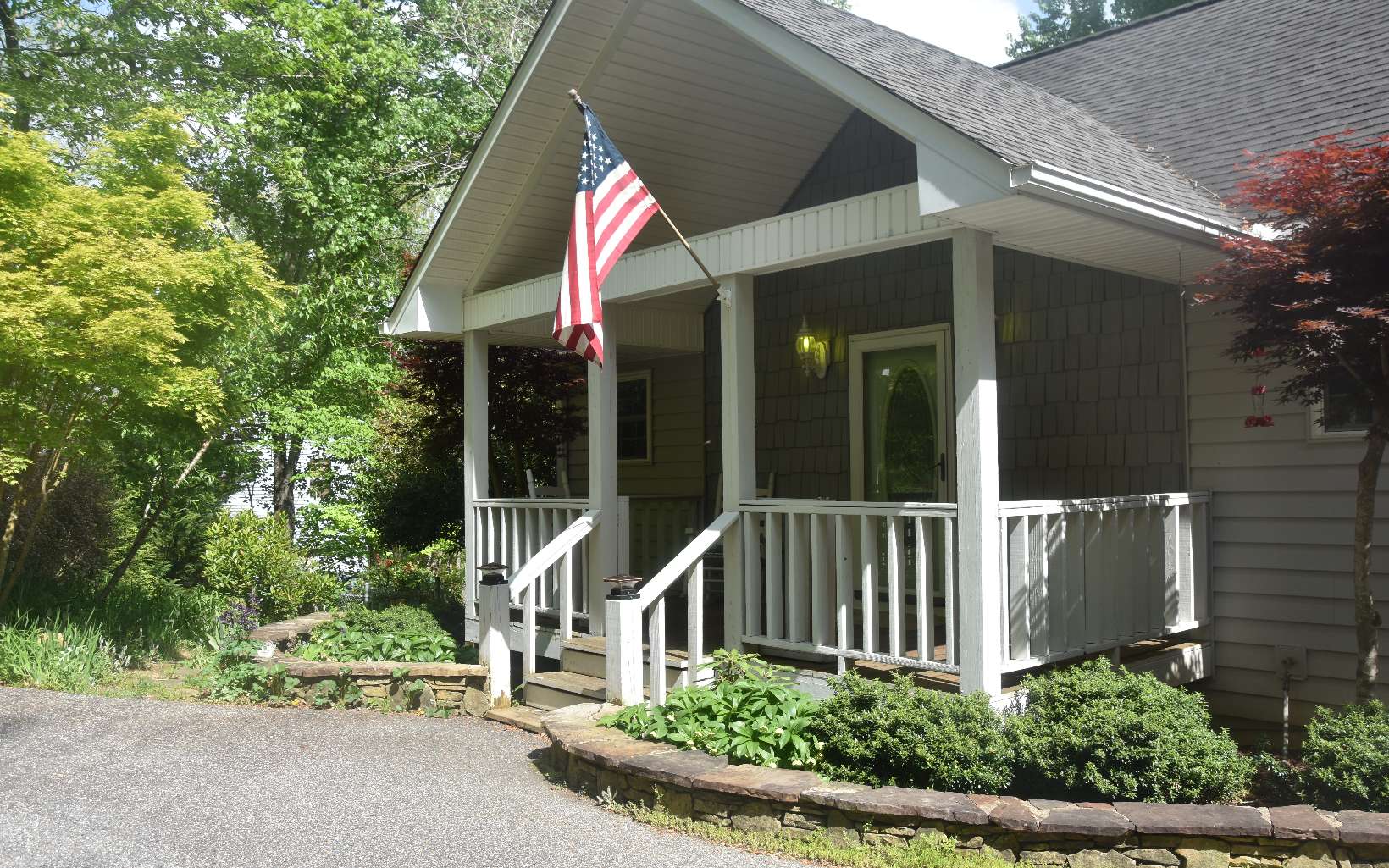 This creek side cottage is in a favorite Hiawassee neighborhood. Vaulted ceiling & hardwood floor in living area enhance the open floor plan with a stone faced gas fpl. The adjacent kitchen has marble countertops & wood cabinetry. Laundry with W/D off kitchen. The main level offers a split guest room and bath & main bedroom w/garden tub,shower and Dbl vanities & walk-in closet. Terrace level with entry has 2nd kitchen,Bdrm,Ba,W&D-hook-ups,living & den/game room, 2nd stoned faced gas fireplace. A Bullfrog spa allows for relaxing soaks while enjoying the rushing creek from terrace. The screened porch off main brings the outdoors into living with seasonal views of Bell Mtn. & year round creek viewing. Beyond the fenced yard is a quiet spot w/fire pit at creek side. Gorgeous blooming year round landscape for any avid gardener. Close to all outdoors activities & daily services of this fabulous location.