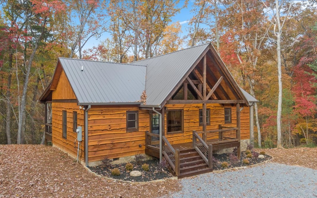 HUGE PRICE REDUCTION!! PLUS** $10,000.00 Buy Down Bonus, Closing Cost, Furniture, Etc. Enjoy This New Home On Your Beautifully Wooded 1.92 Acre Lot! New 2 Bdr/2 Bath 1,056 sqft Home With 2 Fireplaces. One on the Large Beautiful Covered Deck! Upgraded kitchen appliances with gas cooking. Spacious granite kitchen island and countertop's, beautiful granite and tiled bathrooms. Enjoy the the sound of a noisy creek below. Nice Gated "Uniquely Upgraded Small Home Community." Located between North GA's two best lakes. Lake Blue Ridge at Morganton Point and Lake Nottley With nice walking trails and close by Nottely Boat Club and Marina.. Large Lot affords an easy build for an added Garage Apartment expansion. Easy short drive to Blue Ridge, Blairsville and Harrahs Casino In Murphy, NC. Kick Back and Relax Yourselves or Enjoy Kayaking on the Toccoa River. Great Area For Short Term Rental Income.