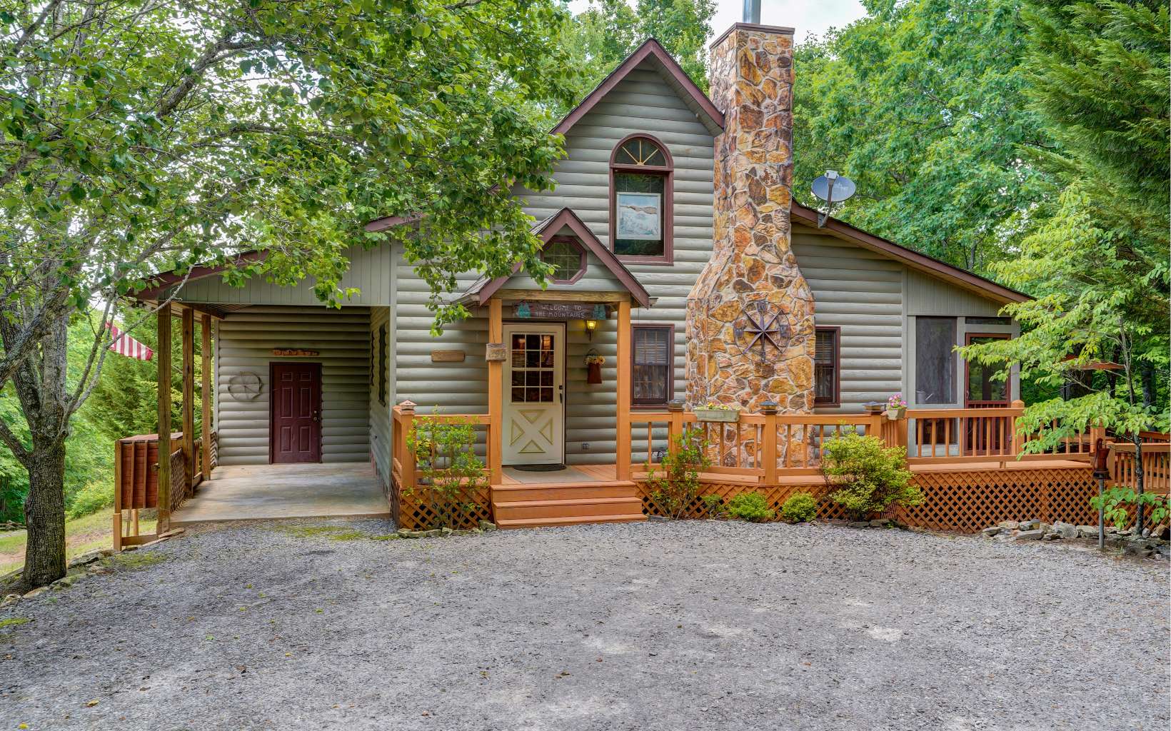 NEW PRICE on this ONE-OF-A-KIND cabin home with additional "TREEHOUSE" living space! This unique mountain home is nestled on 1.49 wooded acres with marked hiking trail to small creek. With 3 decks, screened porch, hot tub & fire pit area, it's an outdoor oasis of relaxation. Inside you're welcomed by a homey cabin feel with luxury amenities that include a jetted tub, large master suite, stone fireplace, hardwood floors, large kitchen w/newer appliances, & vaulted ceilings with abundant natural lighting. Upstairs encompasses a sitting area, private second bedroom & bathroom & private deck overlooking the trees. TREEHOUSE? Yes, there is an extra living space steps away from the main house that includes a front & rear deck, full-size Murphy bed, 2 comfortable gliders, & electric fireplace. Currently a vacation rental, this could be your next getaway, investment opportunity or primary home!