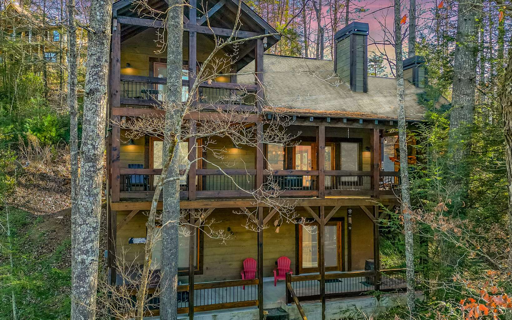 Lodge Style Rustic Retreat overlooking the rushing rapids of MOUNTAINTOWN CREEK! Prepare to be WOWED with direct creek frontage on a Designated Class A Trout Stream! You will love the massive post & beam covered porches, party porch with outdoor fireplace, observation deck & fire pit area near the water's edge. This 4BR/3.5BA plus LOFT is like new and full of character! Selling Mostly FURNISHED.Handcrafted finishes throughout this cabin with great room, soaring cathedral ceiling, timber beams, beautiful stone fireplace (wood burning), blue buggy wood & live edge wood accents. Well appointed kitchen, half bath & dining area. Master & laundry conveniently located on main. Huge LOFT plus 2 bedrooms & bath on upper level. Full finished terrace level has a family room, bed & bath and doors open to terrace patio complete with hot tub. There's also an outbuilding, great storage for all your fishing rods, kayaks & river gear. Perfect for full time, vacation home or will make a great vacation rental investment. Located in popular river resort with amenities galore!