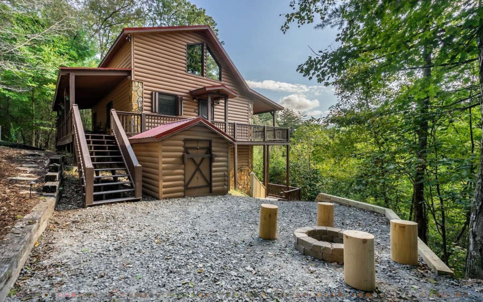 Spacious mountain retreat on 1.43 acres, only 2 miles from Downtown Blue Ridge. Private road with no HOA! Proven exceptional rental history. Cabin comes FULLY FURNISHED from top to bottom, and turn-key ready for the new owners to start renting! Enjoy long-range mountain views from three levels of covered porches spanning the length of the cabin and offering ultimate privacy for guests and couples. This is the perfect investment home, with 3 bedrooms + loft/ 3.5 bathrooms spanning over three levels. Main level with soaring ceilings, new furnishings, push-button gas stone fireplace, oversized Smart TVs, new granite countertops in kitchen, king bedroom with ensuite bath, and half bath off living room. Upper level king bedroom with ensuite bath and private balcony. Terrace level queen bedroom w/ bathroom, laundry, and rec room opening out to a luxurious hot tub. Don't miss out!