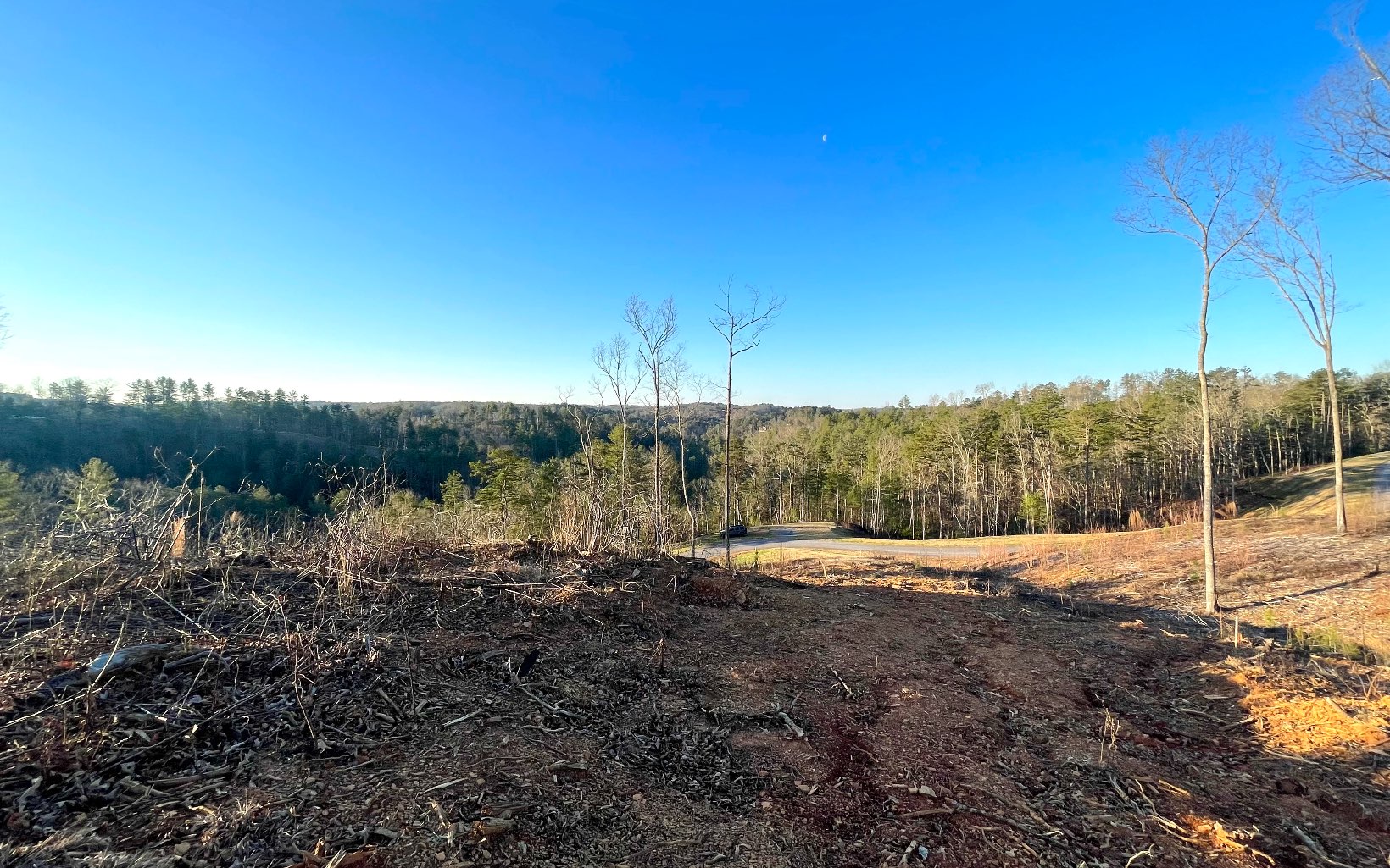 This 3.12 acre lot boasts almost 100ft of Mountaintown Creek frontage with ridgeline mountain views and partially cleared! This is great opportunity to own a lot and build your dream mountain home in the highly sought after High River subdivision in Ellijay, Ga! A stunning newly developed subdivision that offers breathtaking views with creek and lake access! Located only minutes to downtown Ellijay, dining/shopping, wineries, and more!