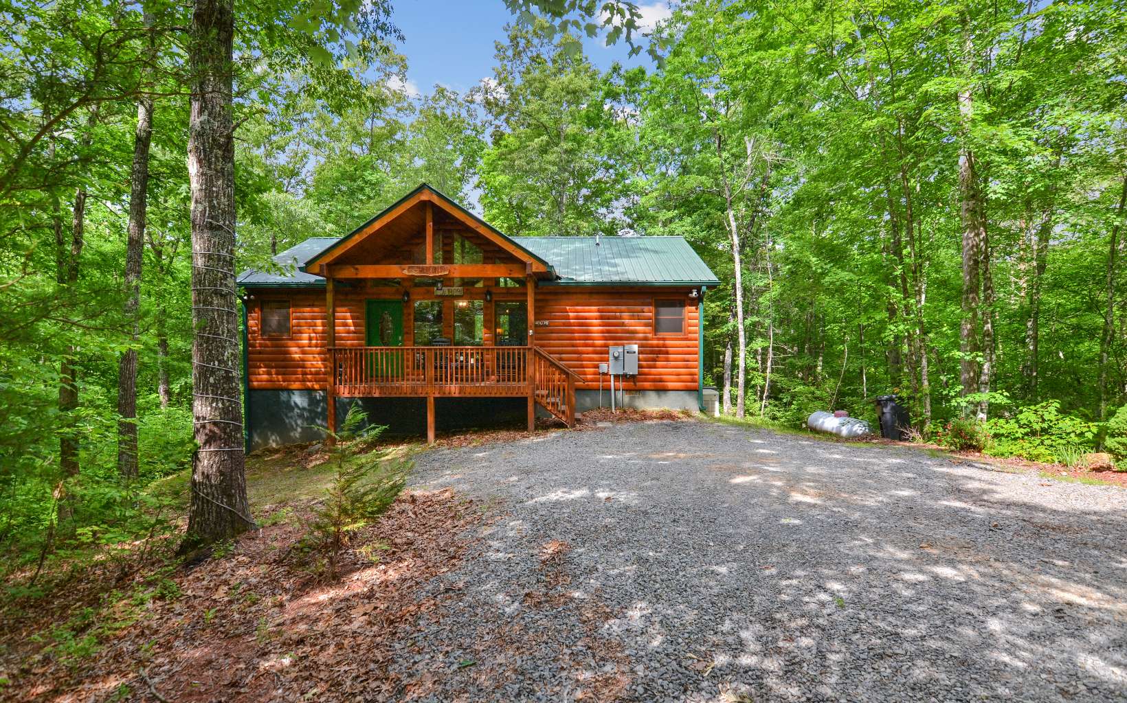 Storybook well maintained 3/2 cabin within minutes to downtown blue ridge, already a successful rental that has all the amenities you could want. Hot tub and game room on the interior and covered screened porches outside. A fenced area for the pets as well as a firepit to relax in the cool evenings. Large windows in the great room allow for large amounts of natural light, wood flooring throughout, spacious kitchen with granite countertops and breakfast bar. Outdoor storage shed is included as well as a whole house generator for peace of mind. 1.17 acre level lot for privacy, level lot and all wood exterior provide low maintenance, lower than average utility costs and also being sold furnished. Would also make a great weekend or full time home. Start your journey in north ga now!