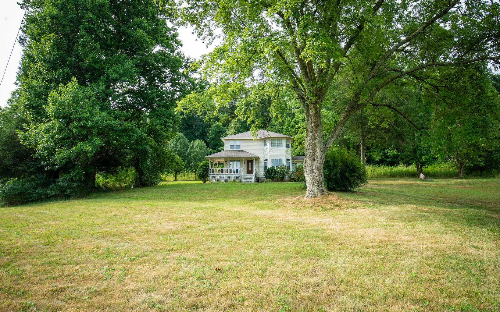 Adorable farmhouse style home on sprawling lot. Private drive, gorgeous mountain views, wrap-around porch, side sunroom, & back deck. Large living room with fireplace. Breakfast nook with bay window. Primary bedroom suite upstairs has bay window & double closets. Won’t take much to make this one a show stopper!