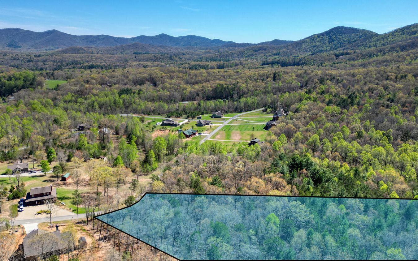 Look at this great building lot that Joins National Forest land in the North Ga Mountains and is Located in gated Sharp Top Settlement, between Blue Ridge and Blairsville. This tucked away neighborhood provides paved roads, public water and a beautiful, peaceful setting for your Mountain dream home.