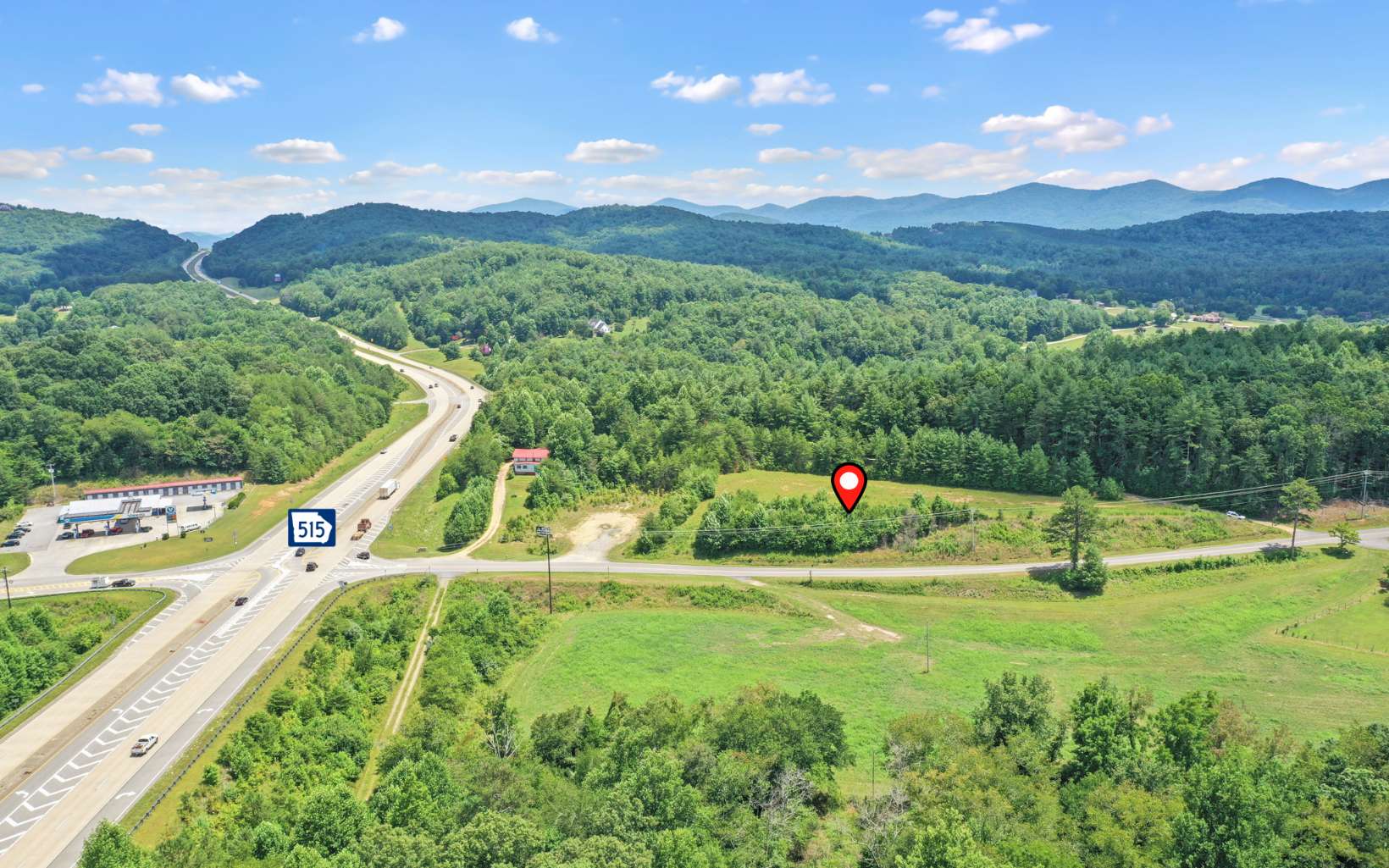 Incredible commercial opportunity with amazing HWY 515 exposure located directly in between the booming towns of Blue Ridge and Blairsville. Graded elevated lot ready to start building now overlooking HWY 515- Dual access zoned C3 with Power and City water available. Exceptional value for hard to find high traffic HWY 515 exposure.