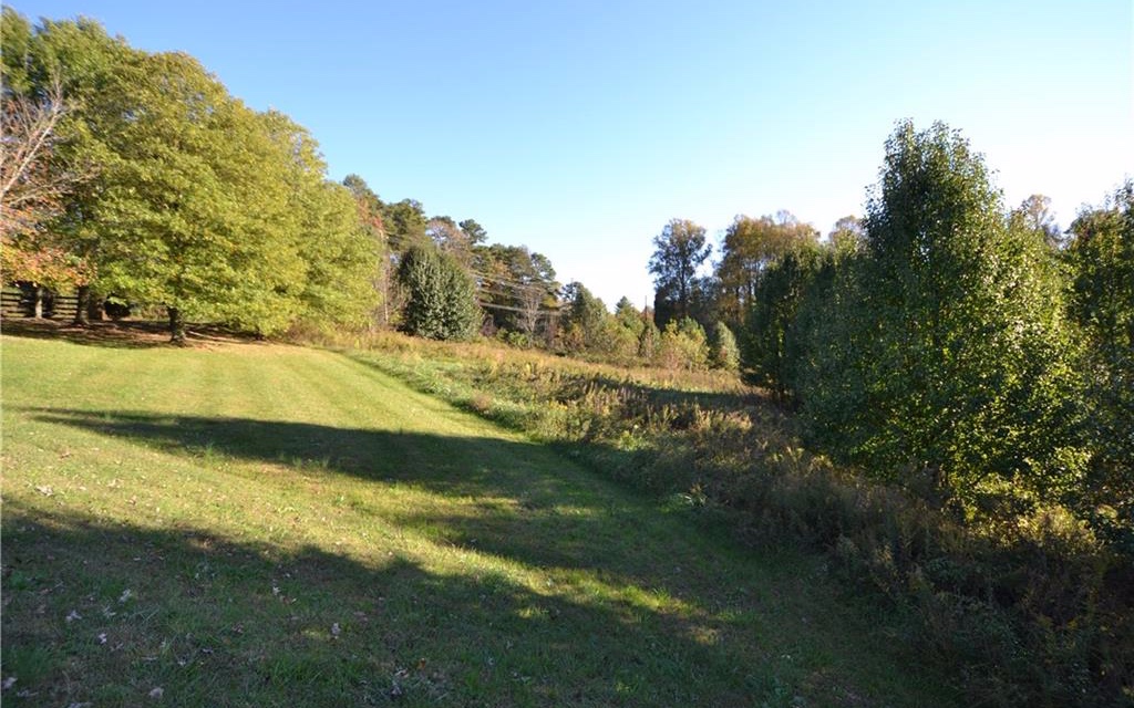If you are looking for a beautiful building site take a look at this 2 acre tract situated in the Lucky Hollow Farms Neighborhood. This acreage lays well and is less than 5 minutes to Walmart and Hwy 515 and offers all paved roads, has under ground utilities and county water. Bring your builder and get started on your new home!