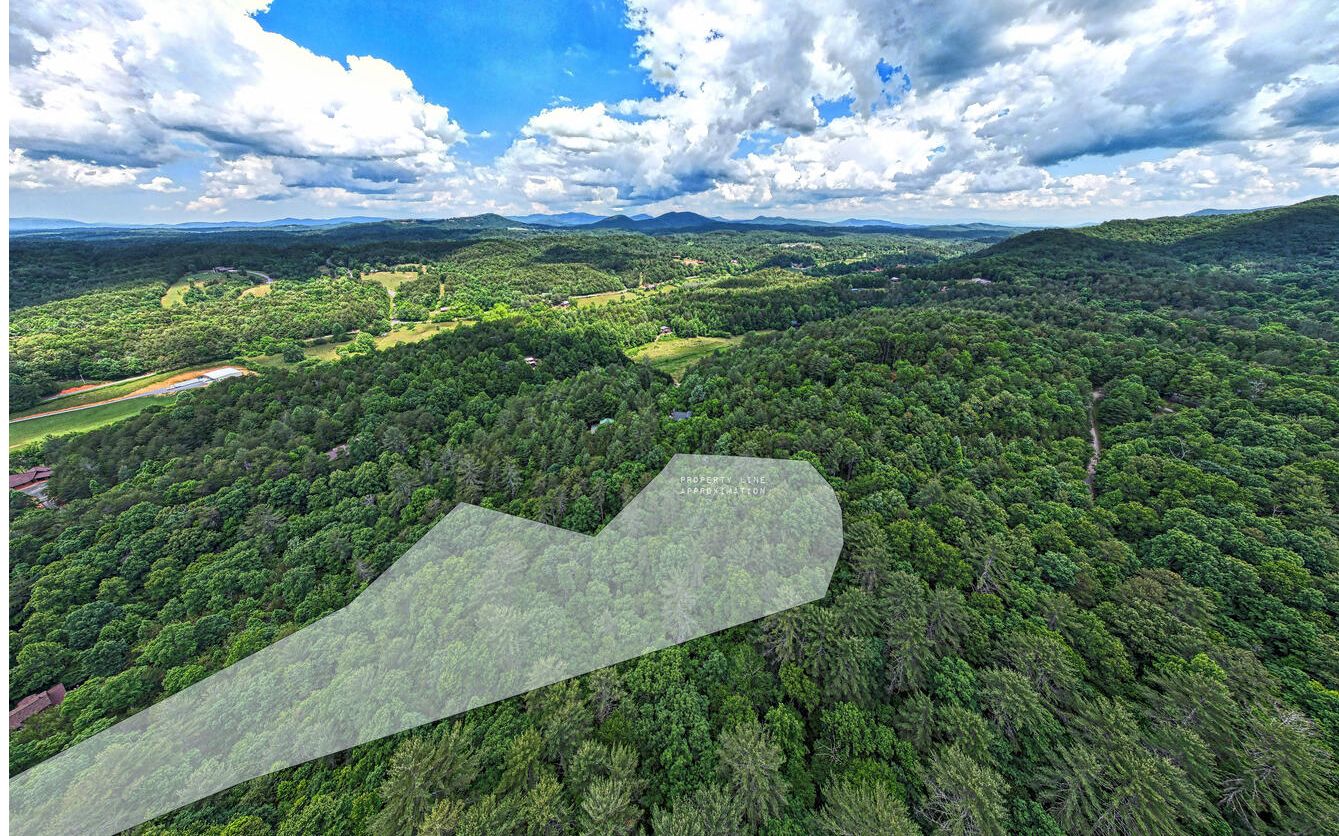 Enjoy private serenity, seasonal mountain view’s, a stream and waterfall on this 6 acre wooded unrestricted lot. This property is best purchased together with MLS #325044. Combined acreage equals 7+ acres.