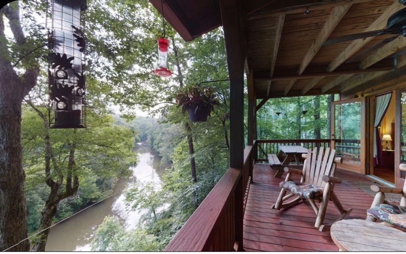 Sitting on 200' of the rivers bend of the beautiful Coosawattee River, this four bedroom, three bathroom home truly has it all! Whether you are looking to relax and listen to the rushing river, with the amazing views or spend some time inside by the beautiful fireplace. With 16 years of rental history this home features a beautiful mixture of rustic and upscale. Featuring hardwood floors, big bedrooms, granite counter tops, stainless steel appliances, a pool table, hot tub, infrared sauna, and four decks to enjoy, as well as a loft for some extra room for guests, this cabin has all the room you need! The Coosawattee River Resort also features, three pools, tennis courts, a fitness center, basketball courts and beautiful parks throughout for you to enjoy. Come check it out, this one won't last long!