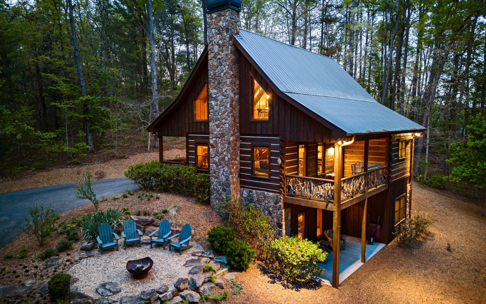 Welcome to White Oaks—a private mountain community located minutes from downtown Blue Ridge, hiking trails, kayaking, and a Golf Digest award winning gold course. This rustic setting provides the backdrop to BLUE RIDGE TIME cabin, where time stands still and one can breathe freedom. Beautifully appointed, modern furnishings create a juxtaposition against the true log chink cabin to combine the old and the new. Upon entrance you are greeted with real Acacia hardwood floors throughout the home and local mountain laurel railings, Tom Dixon lighting, high wooden-beamed ceilings, and an open floor plan. Stay cozy by the crackling of the outdoor fireplace in the screened-in party porch, relax in the new model hot-tub, watch the fireflies from the garden sitting area, or enjoy the annual 4th of the July fireworks that can be seen from the back deck. A second level living space makes this perfect for entertaining or guests. This fully turn-key cabin can be short term rented while not in use. Property video available upon request.