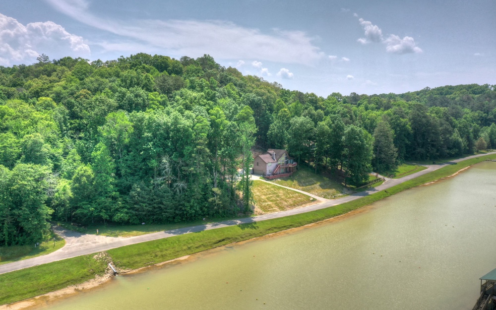 Gorgeous lake front lot in a private water ski community! Bring your skis and enjoy the South East's premier Water Ski Community, Whitestone Lake Estates. Spectacular corner lot located in the middle of both lakes, making it hands down the best lot in the subdivision. Amazing views, all paved access, and just minutes from downtown Ellijay w/ dining, shopping, mountain biking & hiking. Lot ownership gives you access to 2 boats, 2 lakes, 1 jump ramp & 2 slalom courses. This is a water skier's paradise!