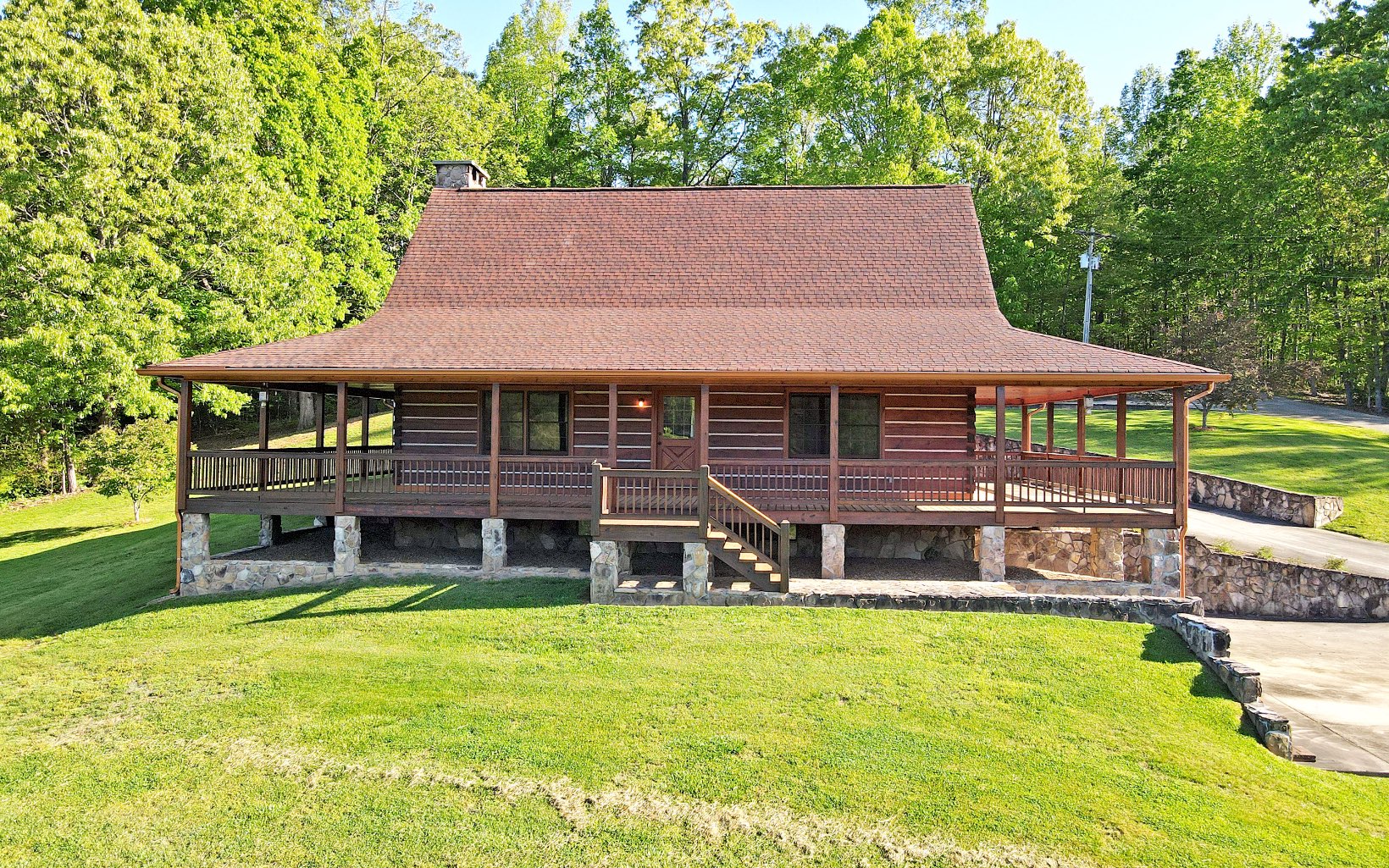 Pride of Ownership Beams from this 1 Owner Solid Chink Log Home. Never Before on the Market 2/2, Full Unfinished Basement, 3 Miles to Town, Year Round Views & NO Restrictions! Att: Car Enthusiasts, Carpenters, Photographers, Artists or Any Entrepreneurs Dreaming of Running their Business from Home! Say Hello to the Fabulous Detached 30x50 Workshop that could also be used as a Private “In-Home Studio!" Main Level 2 Car Garage = 1,280 Sq Ft, Carport & Basement Garage. Over 2 Acres, Room for a Garden. 1160 Sq Ft of Wrap Around Decking to Enjoy the Views & Country Setting! Step Inside: Gorgeous Soaring Ceilings, All Wood Interior, Floor to Ceiling Rocked Wood Burning FP. Kitchen w/ Large Dining Area, Wood Floors & Exposed Wood Beams. Whole House Wood Heater. Lots of Potential with this Stunning Cabin! Close to the Beasley Knob OHV Trails, Vogel State Park & Lake Nottely!