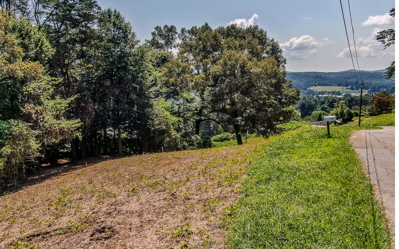 Looking for a great building lot near downtown Ellijay? Look no further! Huge long range mountain views from this lot PLUS gorgeous over views of downtown Ellijay. Paved roads, sewer, and public water. Located within the City of Ellijay limits. Additional lots available. These are some of the last lots available with views like this so close to downtown.