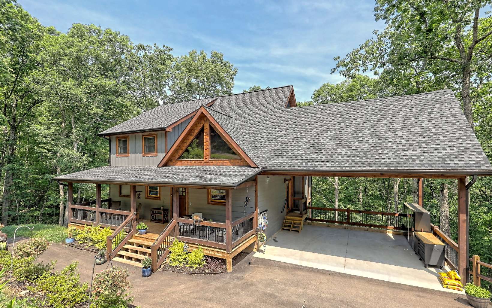 This Impressive Modern Rustic home is designed with stunning finishings in the Desirable Staurolite Mountain Gated Subdivision! This 4BR/3.5BA on 1.77 Acres is privately tucked away yet it is less than five minutes from downtown Blue Ridge. A wonderful entertaining home with an open Kitchen/living room area, custom cabinetry, granite countertops, stone gas log fireplaces, custom bathrooms and countless upgraded finishes. 2 levels of decks, screened porch and a full finished terrace level with a wet bar making it a great party area. This home has so much more to Offer! Call me today!