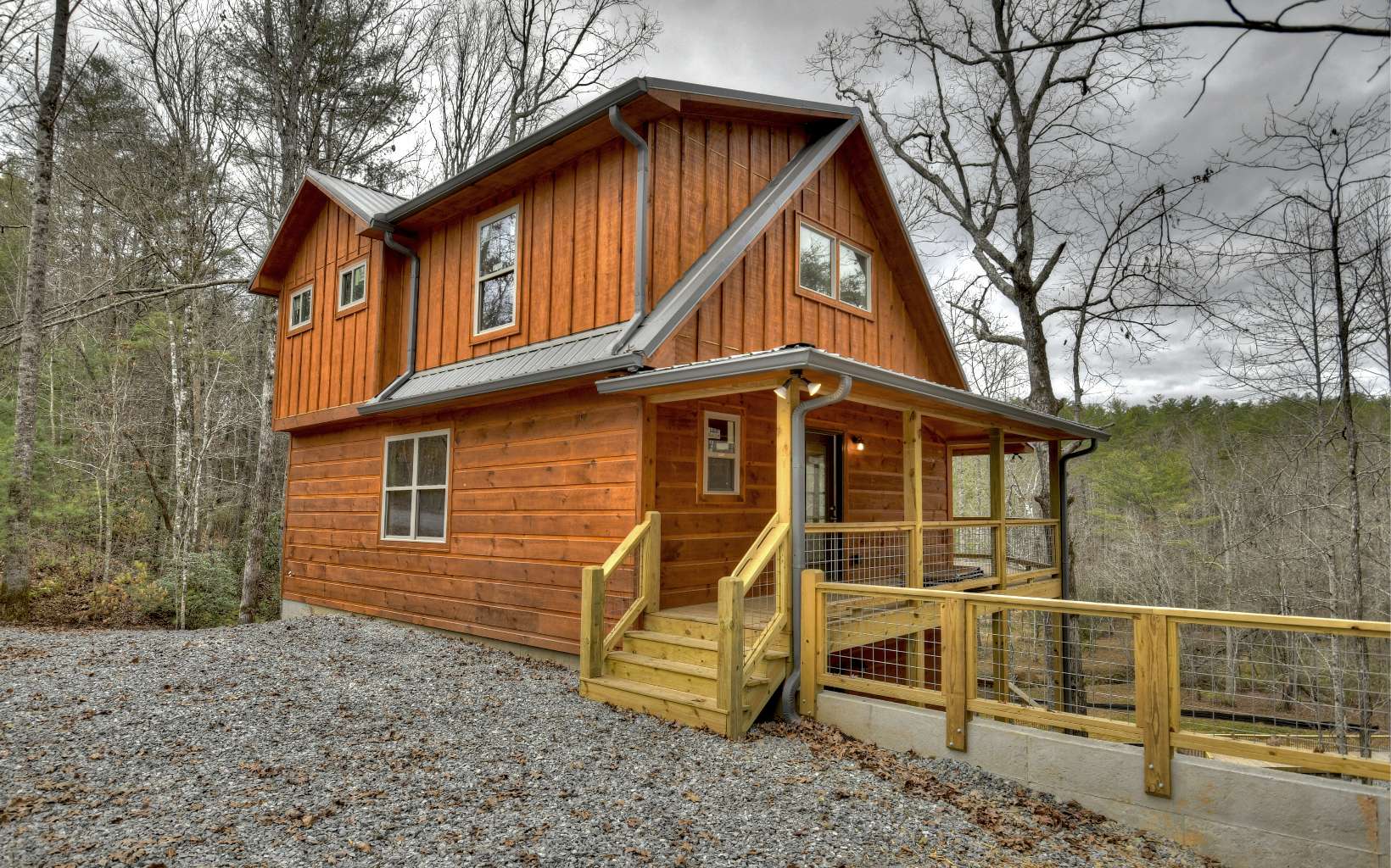 BRAND NEW CREEKFRONT CABIN ON OVER 3 ACRES READY TO MOVE IN!! This 3BR/3BA Cabin has 350' of Creek Frontage & Close Up Mountain Views! This Rustic Cabin Features All Wood Interior, Floor to Ceiling Fireplace, Oak Cabinets, Hardwood Floors, Tile Showers, Two Full Length Back Porches and a Private Balcony off Master, Beautiful Finishes Throughout! Great Layout for Full Time Living or Vacation Rental~ Open Concept Living/Dining/Kitchen, a Bedroom and Bathroom on Each of the Three Levels, Bonus Loft on Upper Level, and Second Living Area in the Finished Terrace Level. Cabin is Situated on a Sprawling 3.07 Acre Lot with Mountain Views and Trout Creek Frontage~ The Lot has a True Park Like Setting~ Surrounded by Woods, the Terrain is Rolling down to the Large, Completely Level and Usable Area Creekside featuring your own Private Oversized Party Deck for entertaining Creekside~ Possibilities are Endless! Located in a Beautiful Area that has an abundance of Wildlife, Area is Surrounded by USFS, and is the Gateway to Miles of Hiking & Biking!