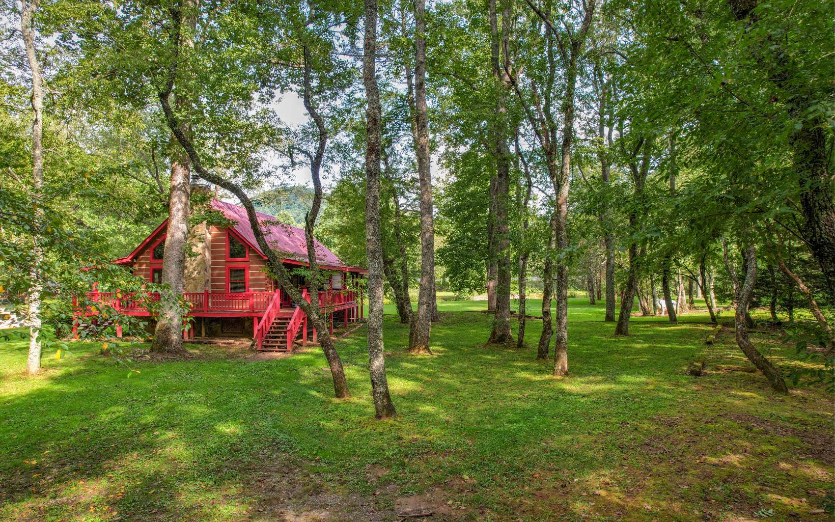 NO SHOWINGS 12/12/2022 through 1/4/2023 ENCHANTING! This beautiful solid log cabin is nestled on a level, picturesque, 1.09 acre lot with over 300 feet of frontage along the Toccoa River, known as one of the best trout fishing streams in the Southeast. You’ll love to call this cabin home. The master suite on the main floor features a large sitting area, fireplace, and french doors that open to a screened in porch that overlooks the river. A second bedroom with bath is also found on the main floor. A third bedroom is located upstairs along with a full bath. The great room features a wood burning fireplace with an adjacent dining area. The kitchen features beautiful cabinetry, granite countertops, a pantry, and seating at the bar for four. Conveniently located to many of the attractions that our mountain paradise has to offer. Most of the furnishings are available on a separate Bill of Sale