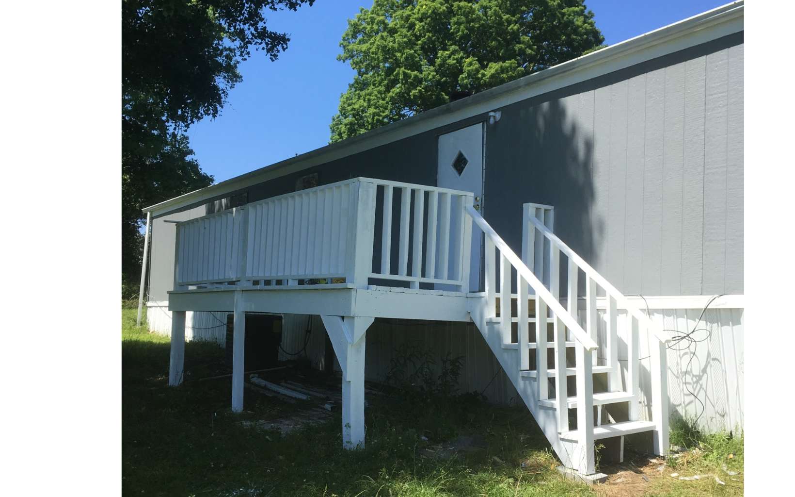 Income generating opportunity in the heart of Fannin County. This property has 4 units , 2 Double Wide and 2 Single Wide Manufactured,fully occupied with a long waiting list. Units have been updated and remodeled within the past 3 years . Current gross income is $39,600 . Landlord pays $1200 annual lawn care and $1200 annual garbage pickup - all other costs are tenant expenses. This is a rare opportunity to have a positive return on investment immediately after closing. Property has easy access from both Madola Rd as well as Wash Wilson Rd. Located in a peaceful residential neighborhood convenient to both Blue Ridge and McCaysville. Each unit has public water. Appointment required to view the interior. Call listing agent Rental 1 - $925 Rental 2 - $700 Rental 3- $925 Rental 4- $750