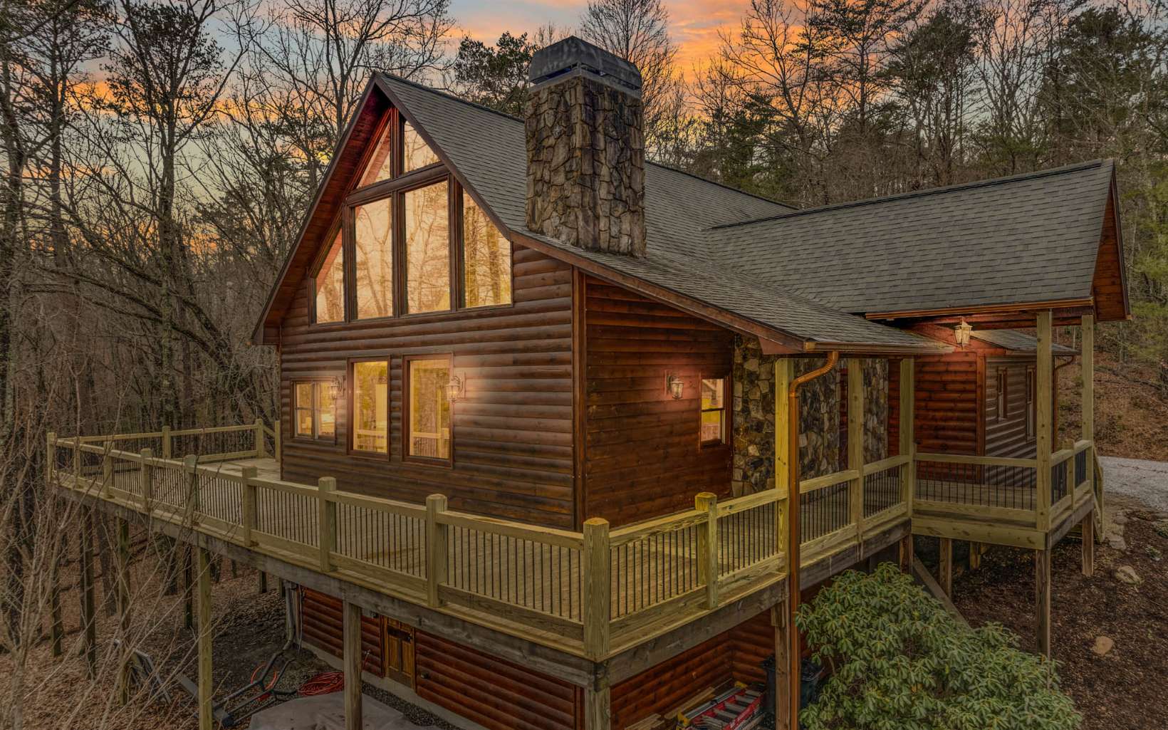 Enjoy the beauty of living in the mountains with the convenience of being moments from town. This lodge style cabin is within city limits of the quaint adventure town of Blue Ridge, Forbes magazine labeled top 5 American Destinations. A beautiful, spacious, and custom-built log cabin, This 4-bedroom home features a private 2+ acre lot, seasonal mountain view, a large exterior deck, an open concept, large living room and dining with huge vaulted ceilings, masonry fireplace, gorgeous wood features, hardwood floors, upgrades throughout, master on the main, walk in closets, en suite bathroom, large open loft, game room, and more. This cabin would make a perfect full-time home with plenty of storage and privacy. It would also make a wonderful second home in the Appalachian Mountains. You will not be disappointed in this well maintained home and the careful attention to details, such as stunning whole log beams etc. See additional features list.