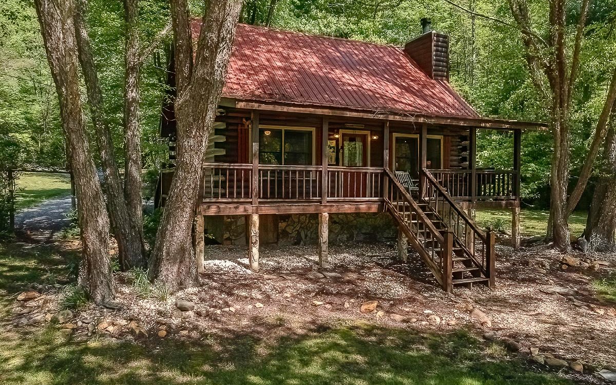 Catch up on your mountain dreams in this Charming Log cabin w/rocking chair front porch overlooking the inviting waters of Oliver’s Pond! Nestled in a picture-perfect setting on 1.84 ac of lovely lush green grass w/ small stream meandering through the property, the turn-key cabin offers 2BR/1BA plus spacious bright & cheery Loft for extra sleeping or inside game time fun; Flagstone wood-burning fireplace; granite countertops; new appliances & completely furnished w/quaint mountain décor. Outside starts family time fishing or paddle boating around the pond w/the baby Geese. Envision cool summer nights w/star lit skies, a roaring fire in the firepit roasting marshmallows, relaxing & enjoying the total ambiance of this property. For daytime excursions, hike over to the USFS & see all the amazing waterfalls or dip a toe or 2 in Fightingtown Creek (a top Trout Fishing Stream in N GA). A true bundle of mountain treasures awaits you here on Oliver’s Pond!