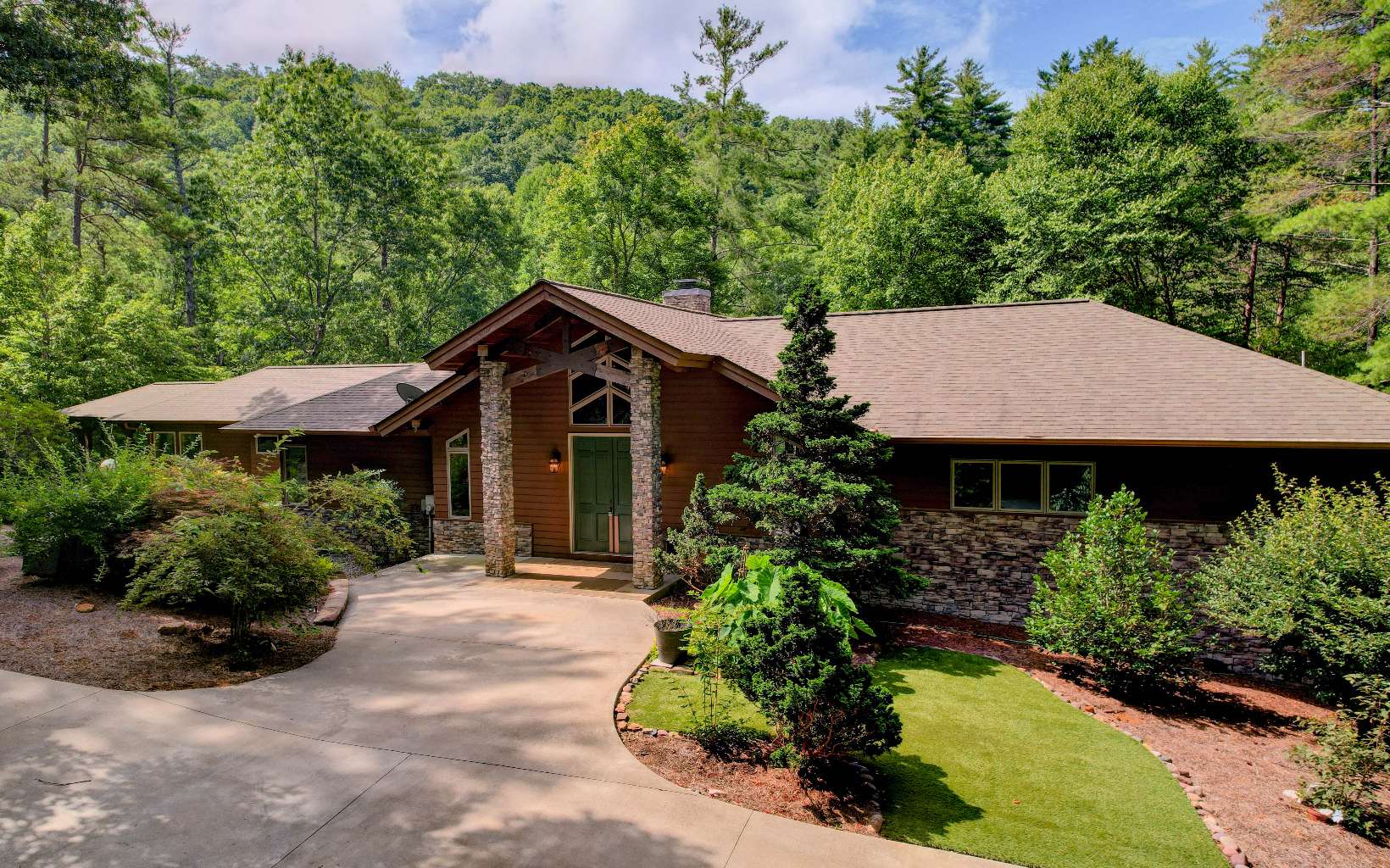 PRICE REDUCED- Mountain Paradise with over 25 acres that includes waterfalls/koi pond, creek, trails, gardens and much more! This home has a central location to both Blue Ridge and Ellijay amenities yet offers complete privacy with low maintenance. Exquisite 3 bedroom (plus office), 3.5 bath home with over 2500 square feet on main level and features soaring cedar ceilings with beams, double sided fireplace, oak floors and a spacious open floor plan. The master suite has double door entry and includes private balcony, master bath with double sinks/cabinets, separate shower and soaking tub, large custom walk in closet and a sunroom overlooking the waterfall/koi pond as well as a private deck. The kitchen includes double ovens, plenty of cabinets and counter space and a large pantry with dumbwaiter. There are 2 additional bedrooms on main level as well as an office with custom built in workspace. One of the bedrooms is an ensuite w/private bath. The partially finished basement includes a 1/2 bath and is ready for completion. Whitepath Golf Course and vineyards are nearby. There are 2 wells and an oversized 2 car attached garage. There is an additional 15 acre parcel that borders national forest that may be purchased separately. Properties like this are a hard find in the area. Come see this breathtaking property and all that it offers! MOTIVATED SELLER